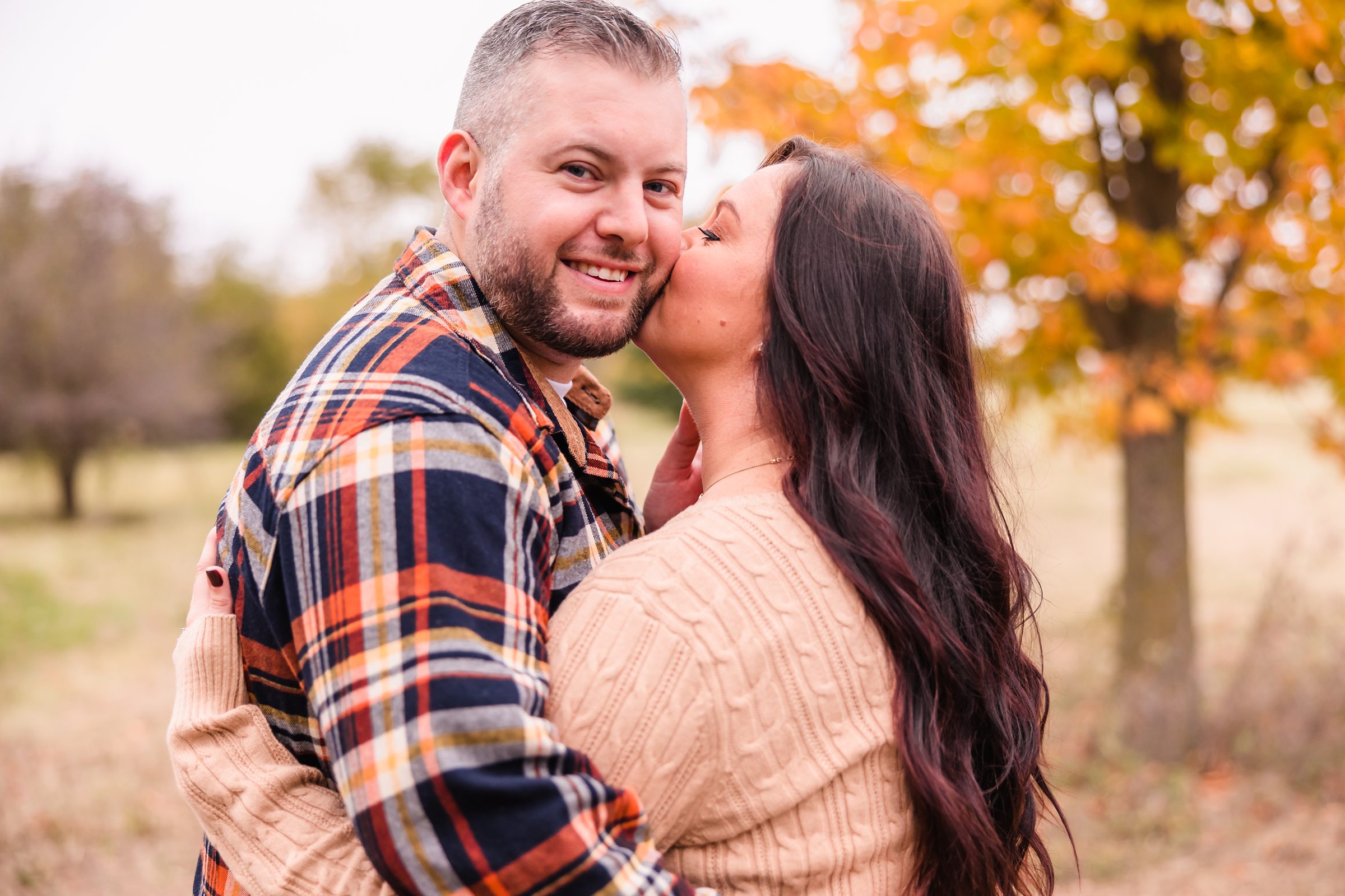 Couple celebrate their engagement at Elders Park in Normal, Illinois. Photograph taken by Illinois Wedding Photographers, Joanna & Brett Photography