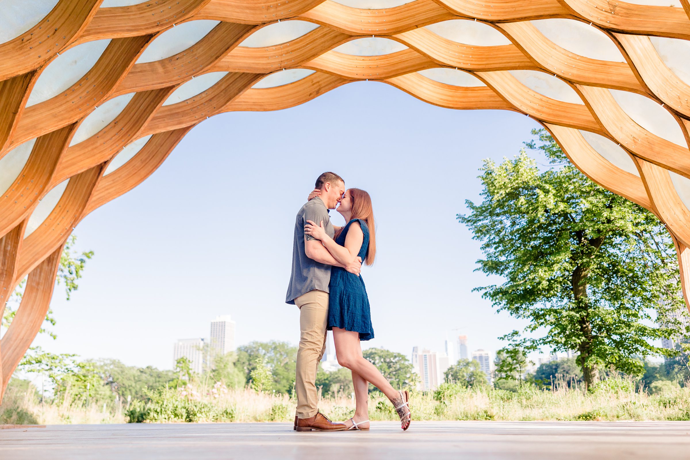 Couple celebrate their engagement at Lincoln Park in Chicago, Illinois. Photograph taken by Illinois Wedding Photographers, Joanna and Brett Photography