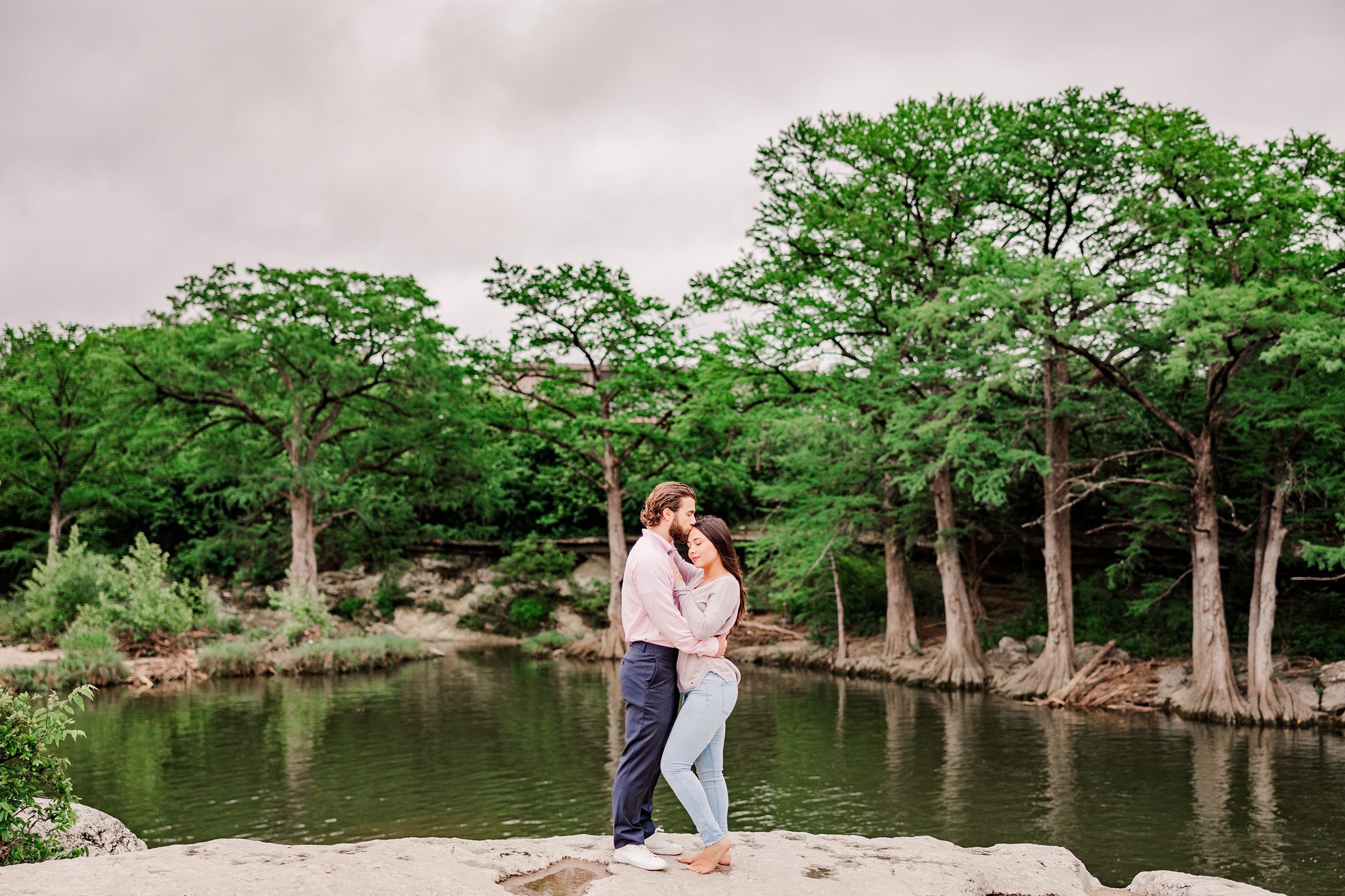 Austin Couple celebrate their engagement at Mckinney Falls State park in Austin, Texas. Photo taken by Austin Wedding Photographers, Joanna & Brett