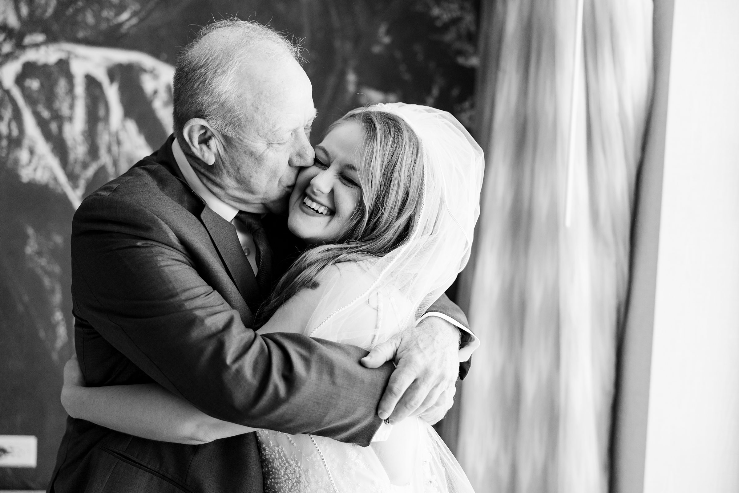 Bride hugs her dad before her wedding in Naperville, Illinois. Photo Taken by Austin Wedding Photographers, Joanna & Brett Photography
