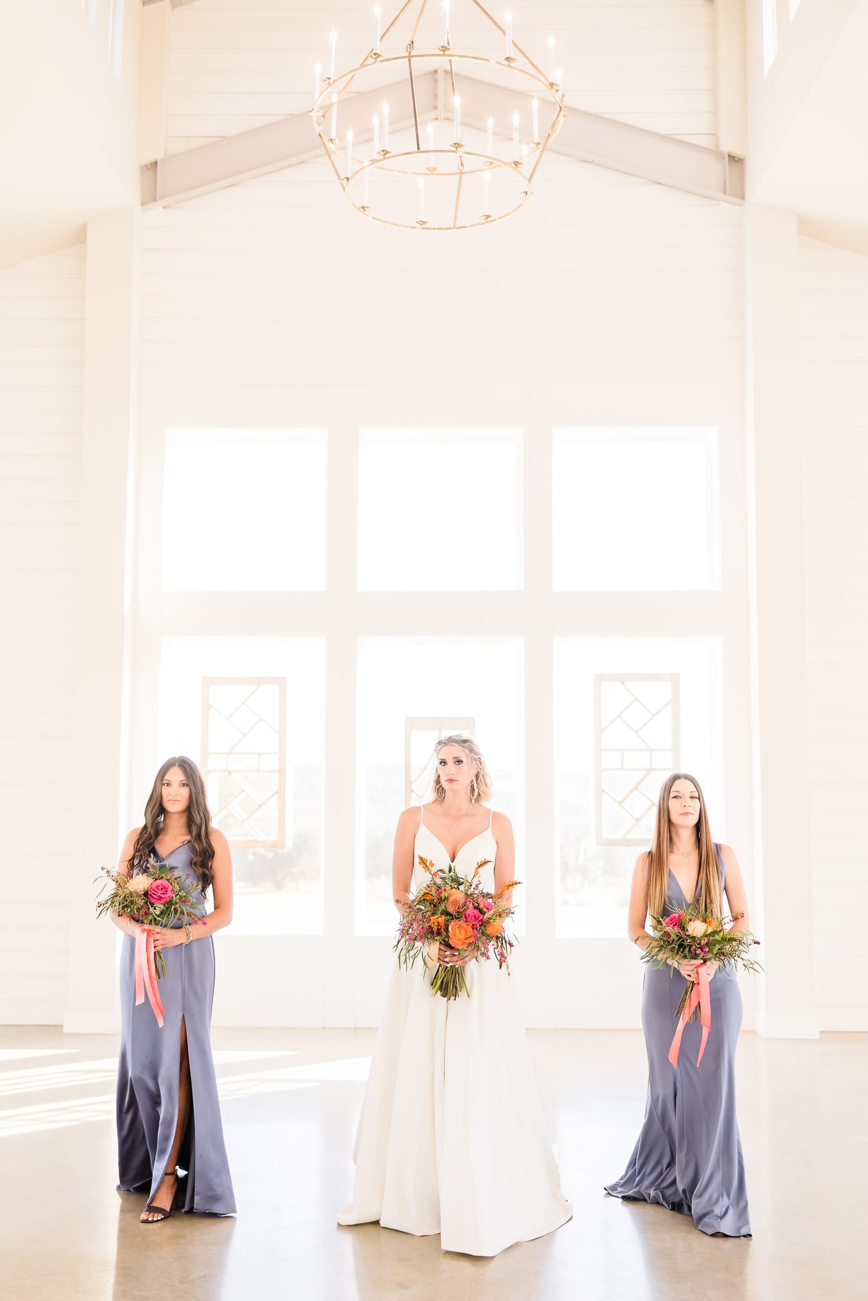Bride and Bridesmaids at the Camp Hideaway Retreat wedding venue in Fredericksburg, Texas. Photograph taken by Austin wedding photographers, Joanna and Brett Photography.