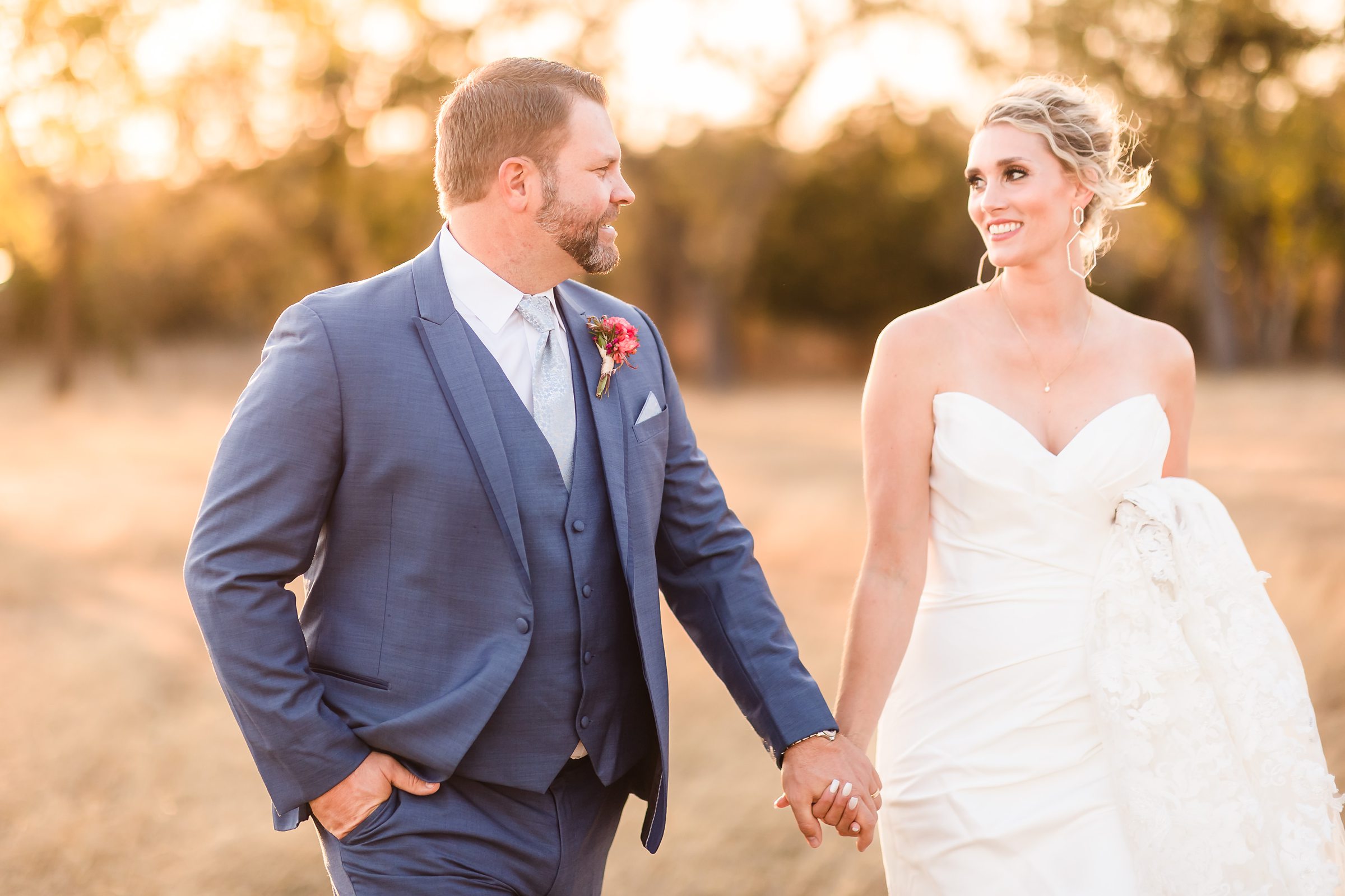 Bride and groom at the Camp Hideaway Retreat wedding venue in Fredericksburg, Texas. Photograph taken by Austin wedding photographers, Joanna and Brett Photography.
