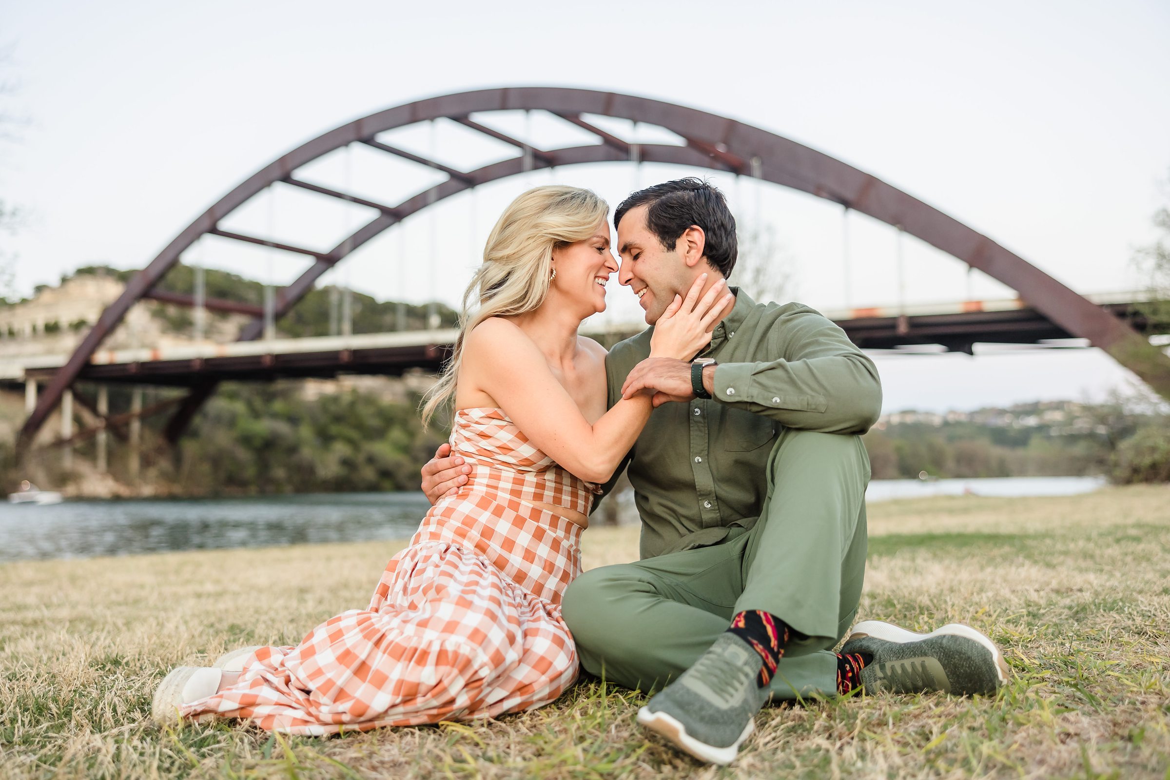 Couple Embrace during their engagement session at the 360 Bridge in Austin, Texas.