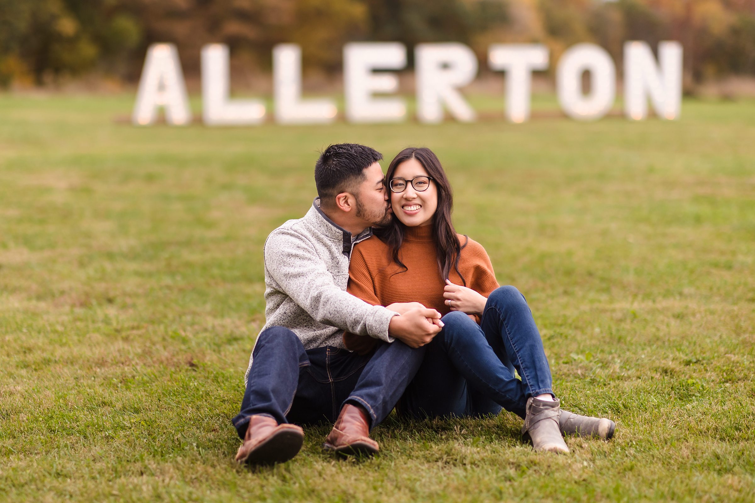 Couple embrace during their engagement session at Allerton Park in Monticello, Illinois.