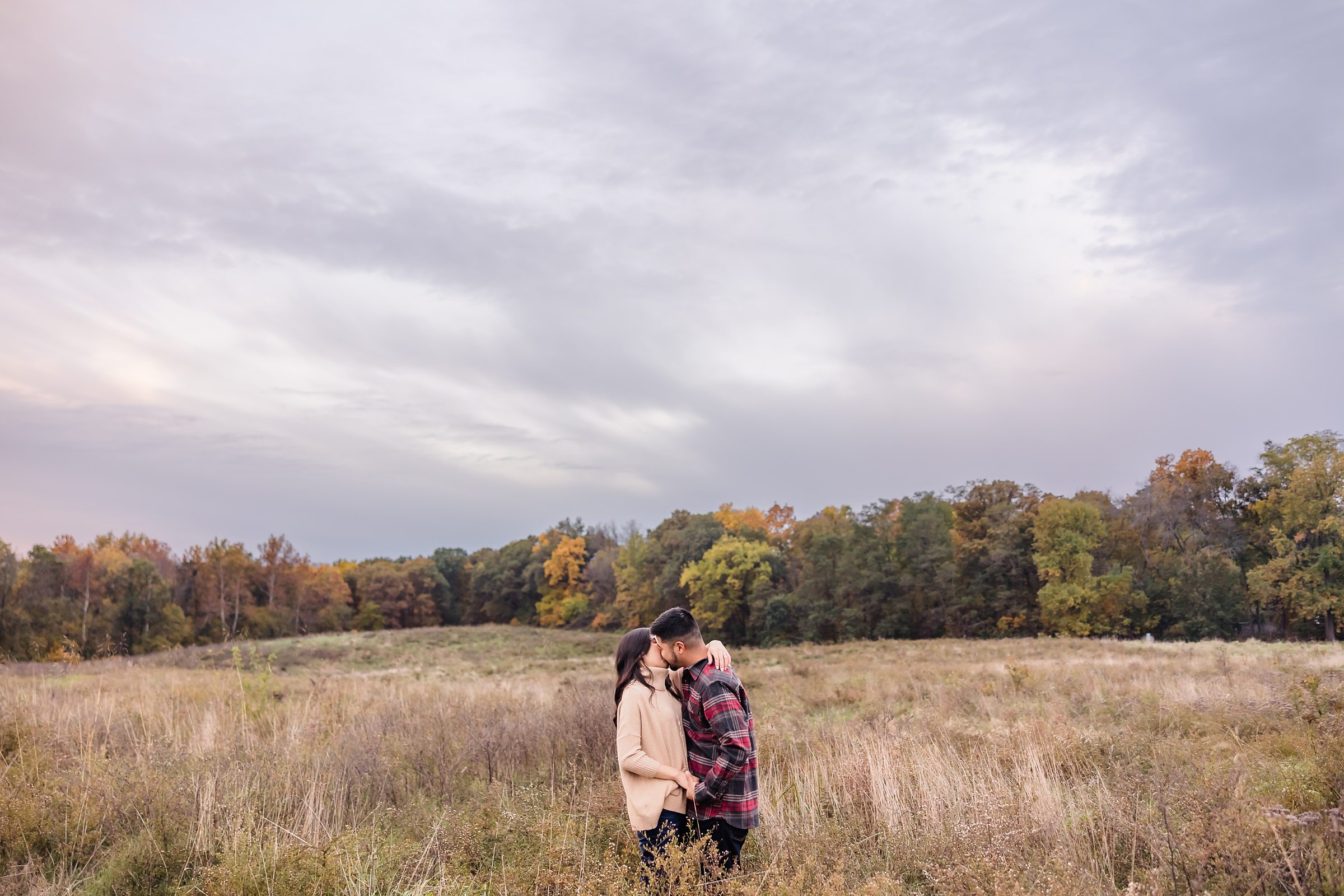 Couple embrace during their engagement session at Allerton Park in Monticello, Illinois.