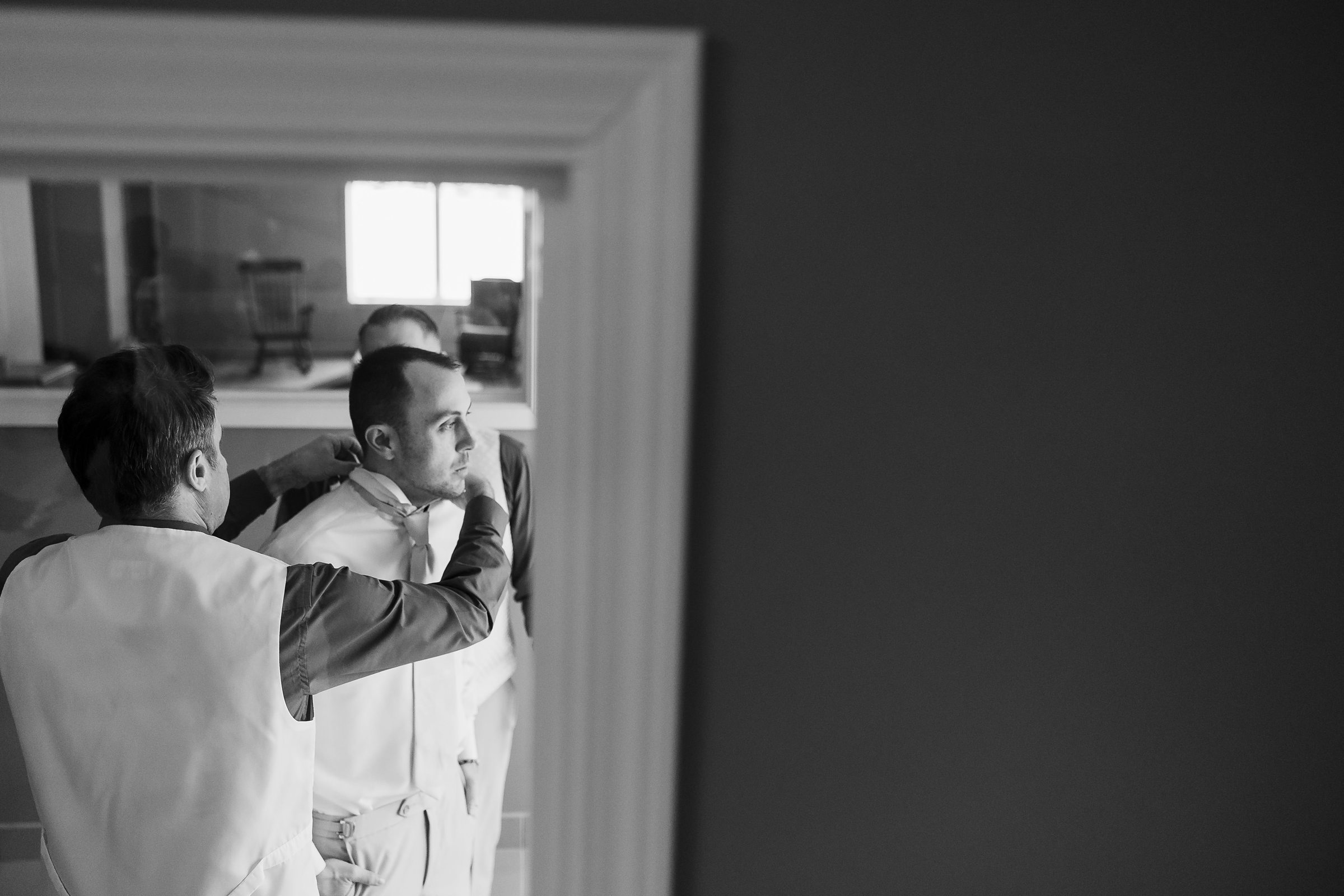 Groom gets ready for his wedding in Bloomington-Normal, Illinois.