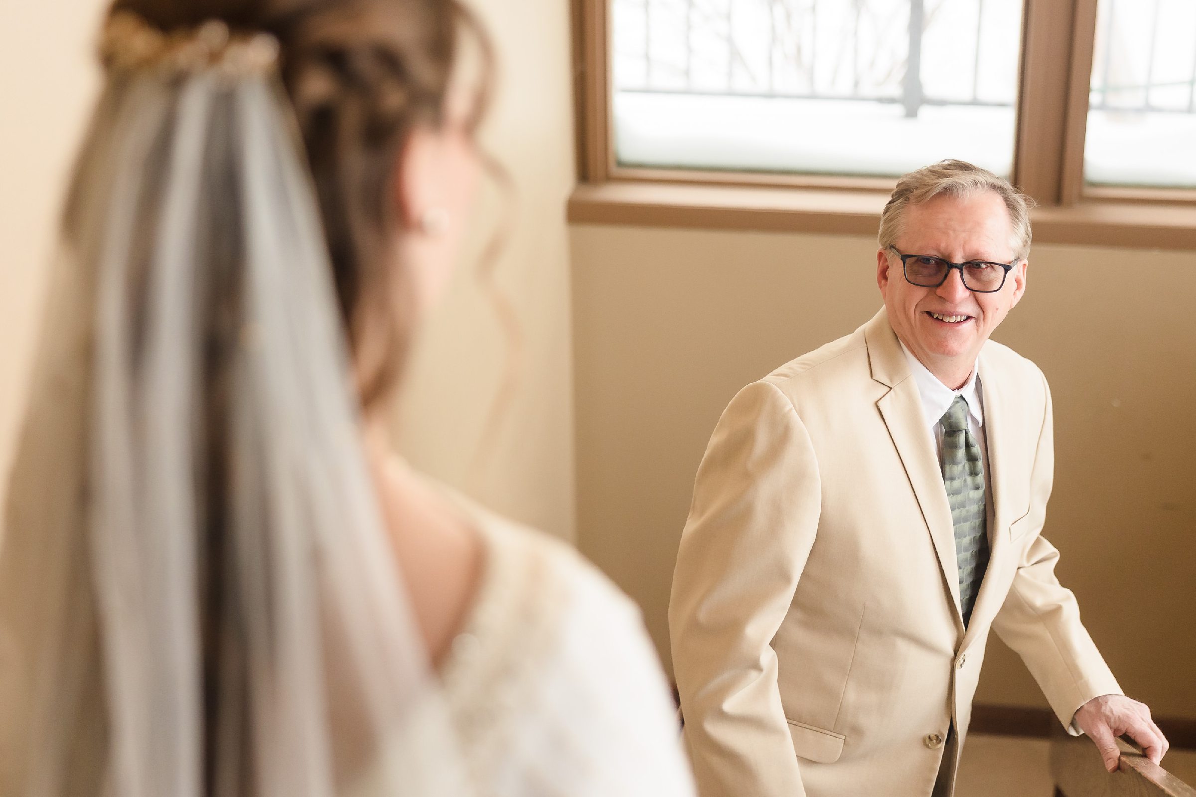Dad sees the bride for the first time during a wedding in Bloomington-Normal, Illinois.