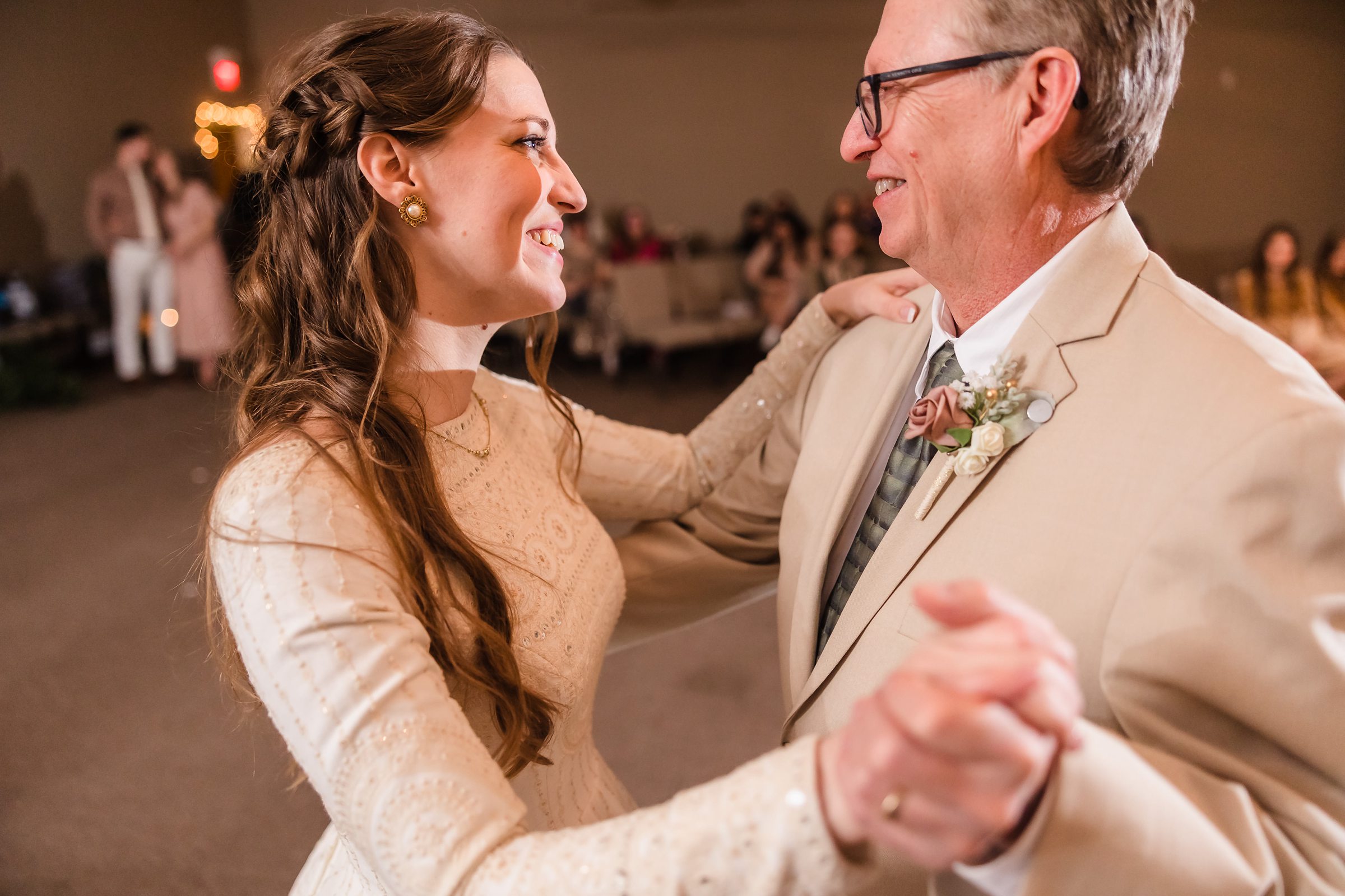 Bride dances with her father during her wedding in Bloomington-Normal, Illinois.