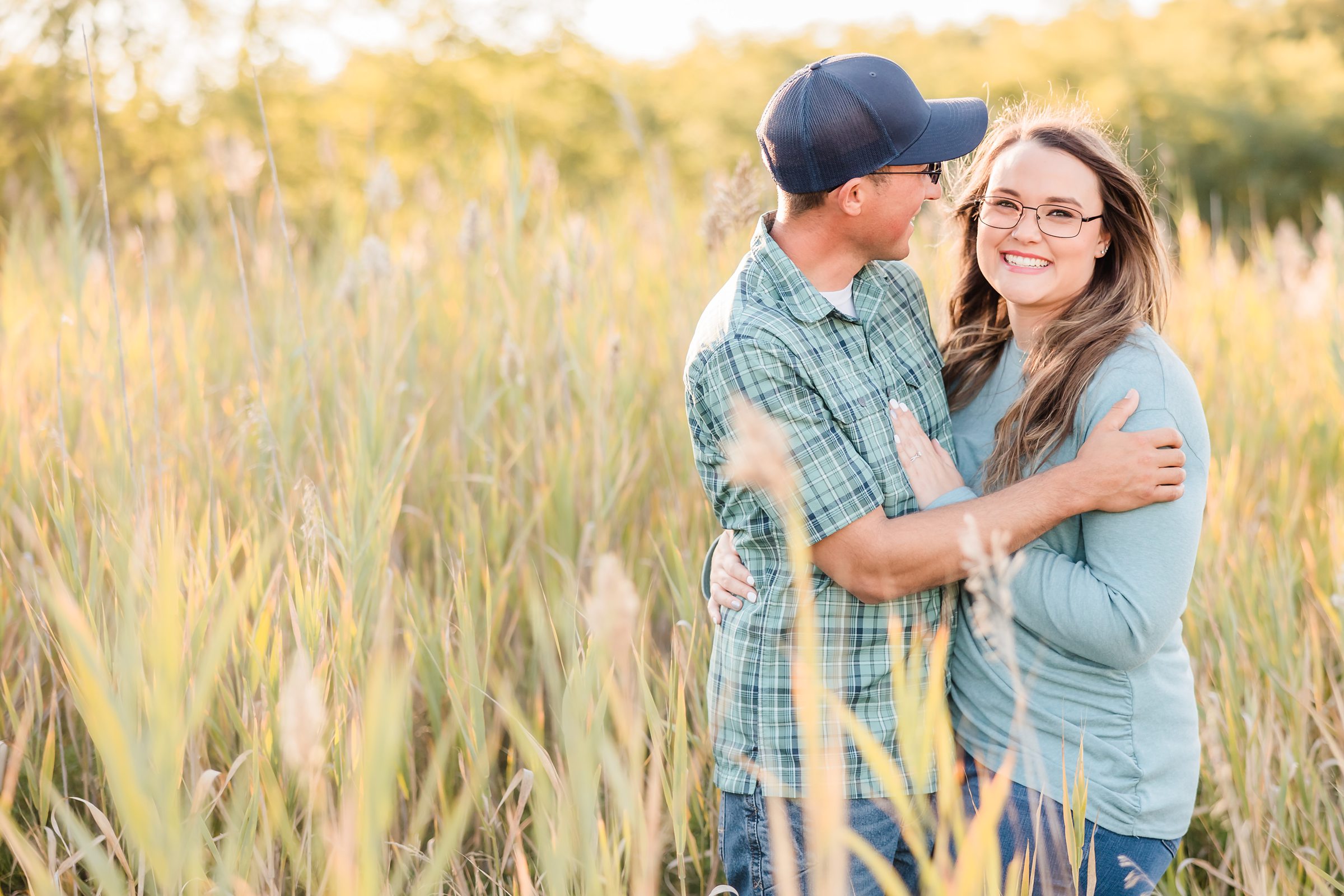 Couple embrace during their engagement session at Buffalo Rock State Park in Lasalle, Illinois