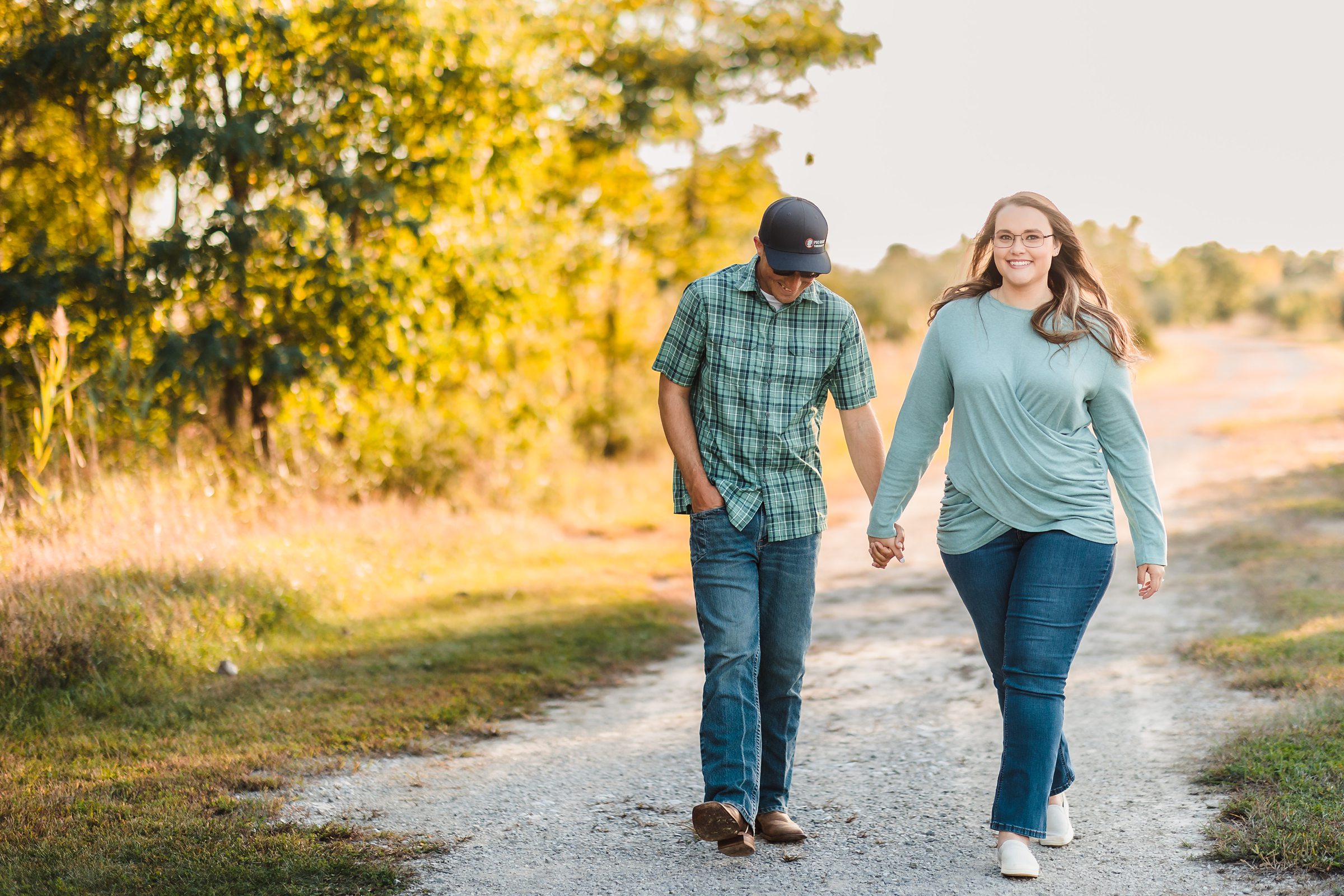 Couple walk together during their engagement session at Buffalo Rock State Park in Lasalle, Illinois