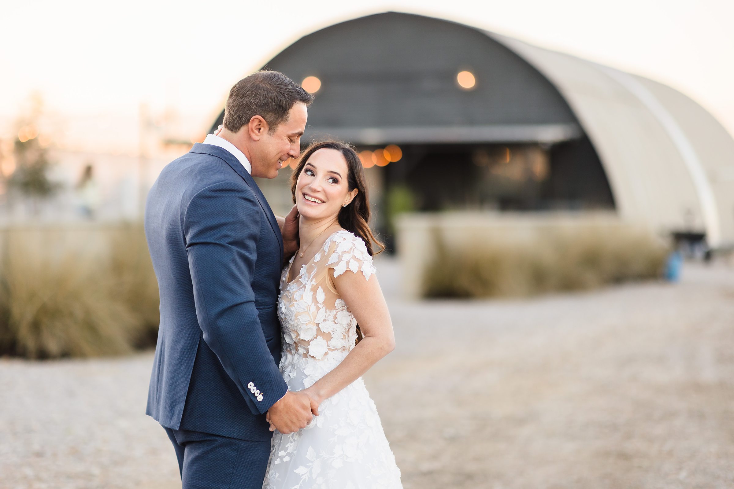 Couple Embraces during their wedding at the Camino Real Ranch in Buda, Texas