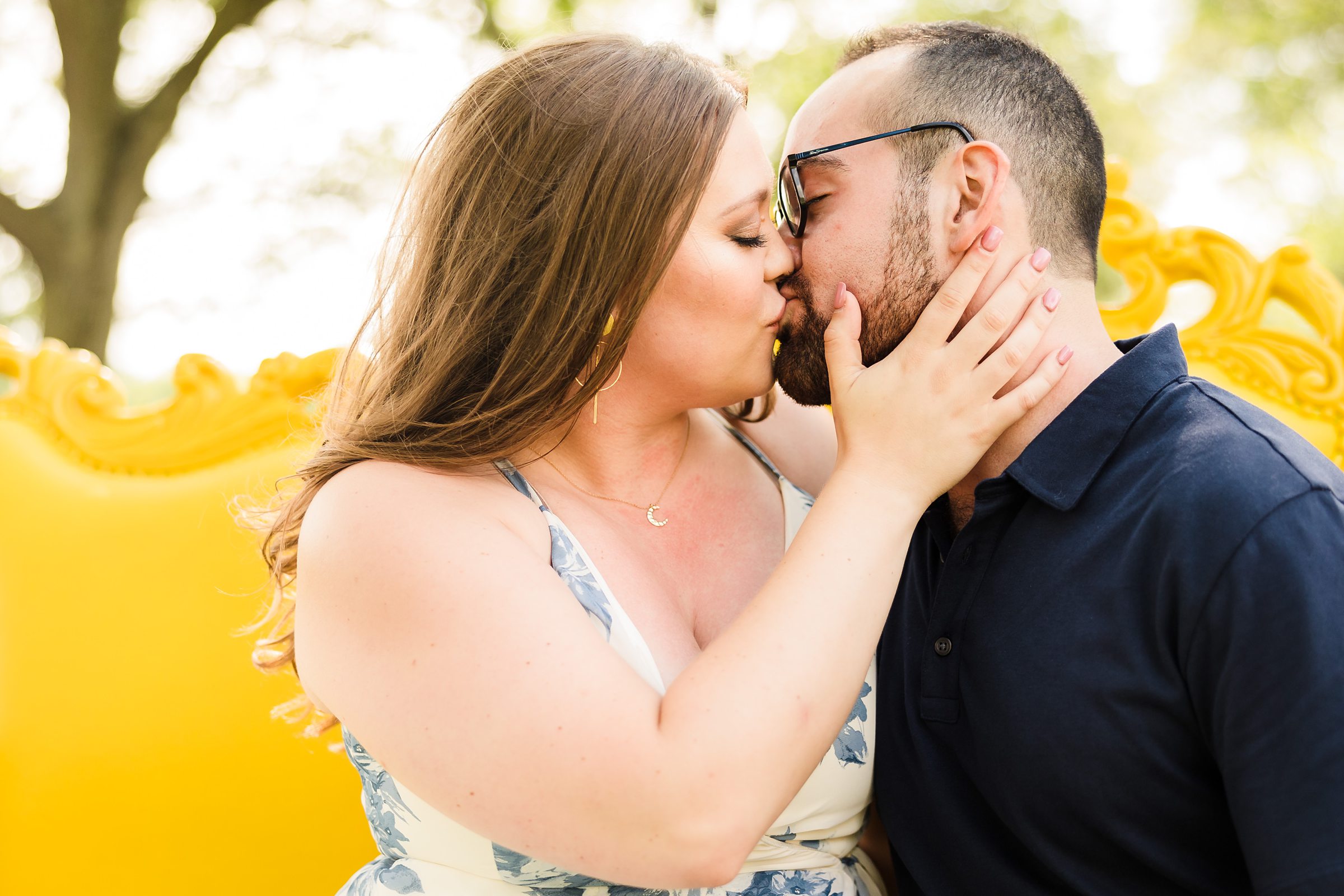 Couple kiss during their engagement session at Cantigny Park in Wheaton, Illinois.