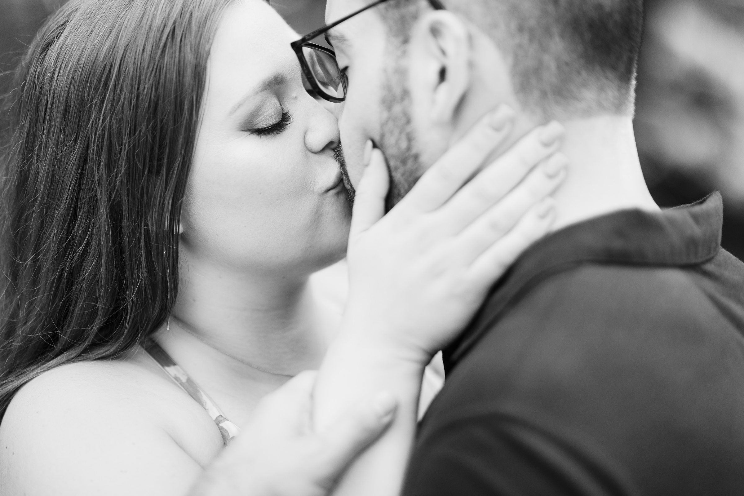 Couple kiss during their engagement session at Cantigny Park in Wheaton, Illinois.