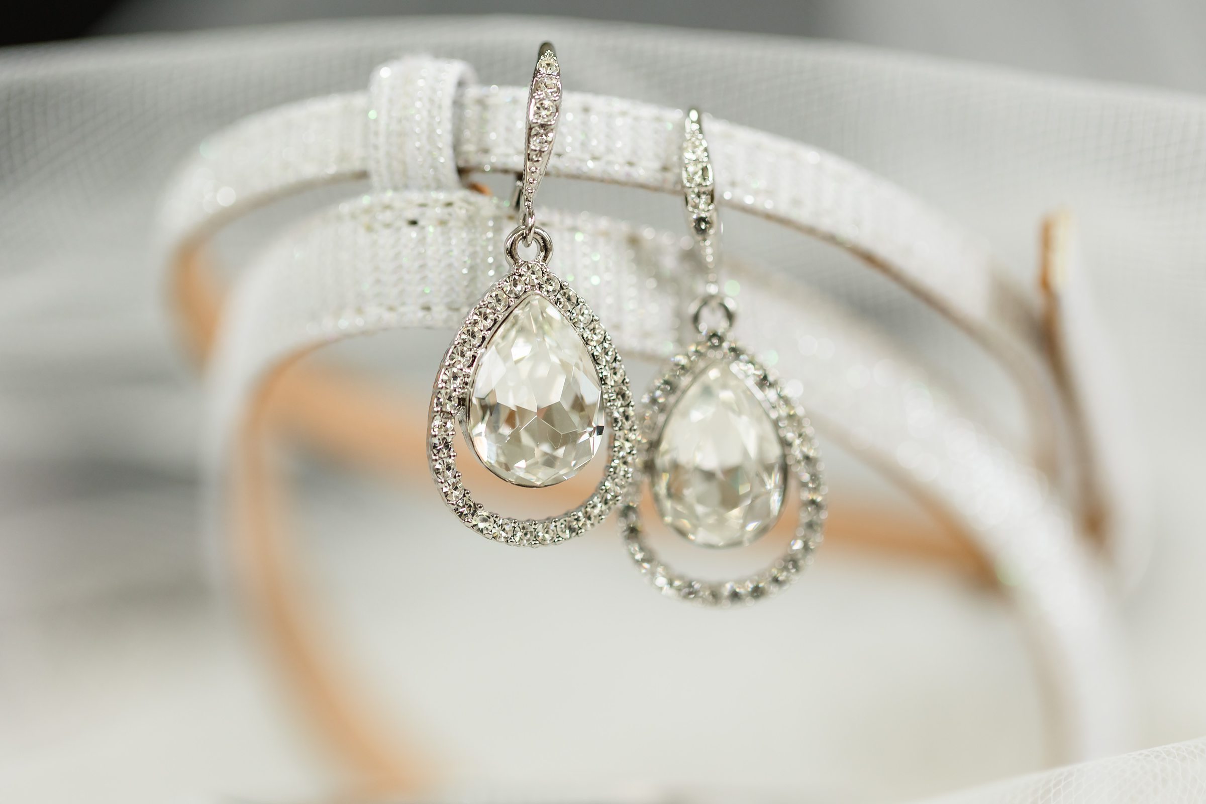 Bride's ear rings during a wedding at the Chevy Chase Country Club in Wheeling, Illinois.