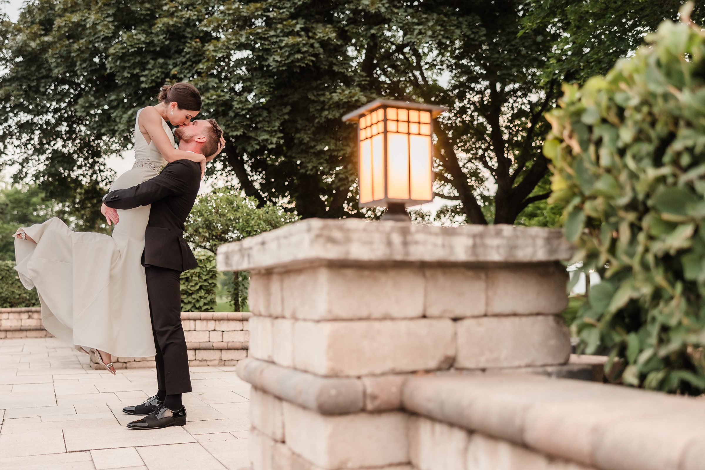 Bride and groom embrace during their wedding at the Chevy Chase Country Club in Wheeling, Illinois.