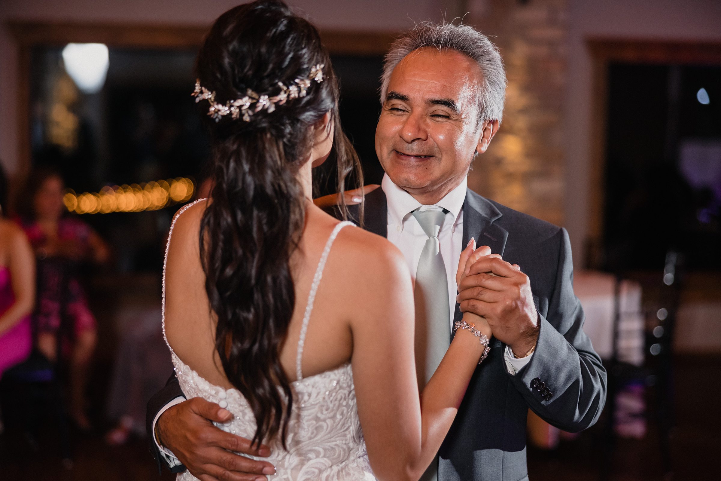 Bride dances with her dad during her wedding at the Fisherman's Inn in Elburn, Illinois.