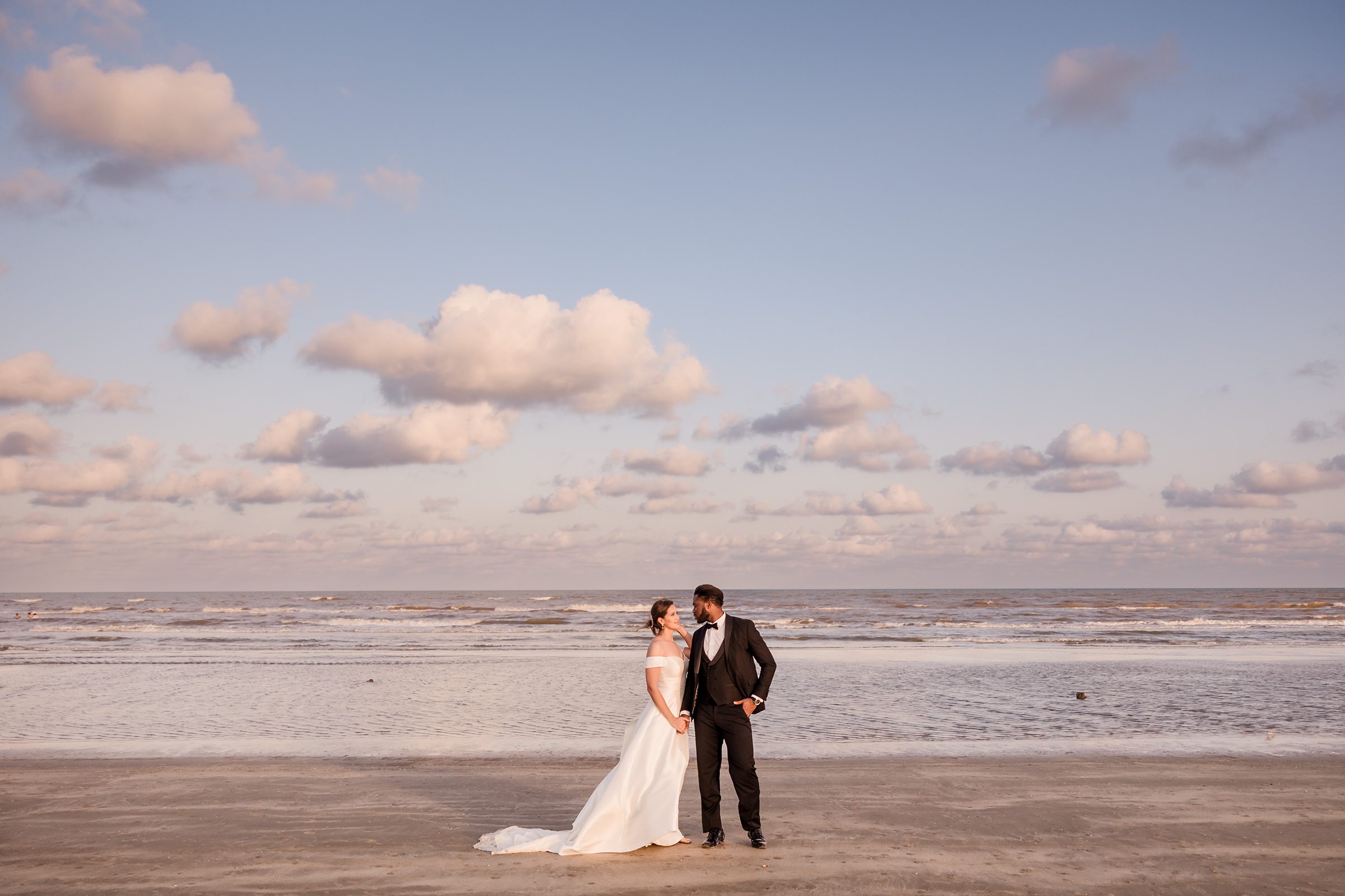 Bride and Groom Embrace during an elopement in Galveston Beach, Texas