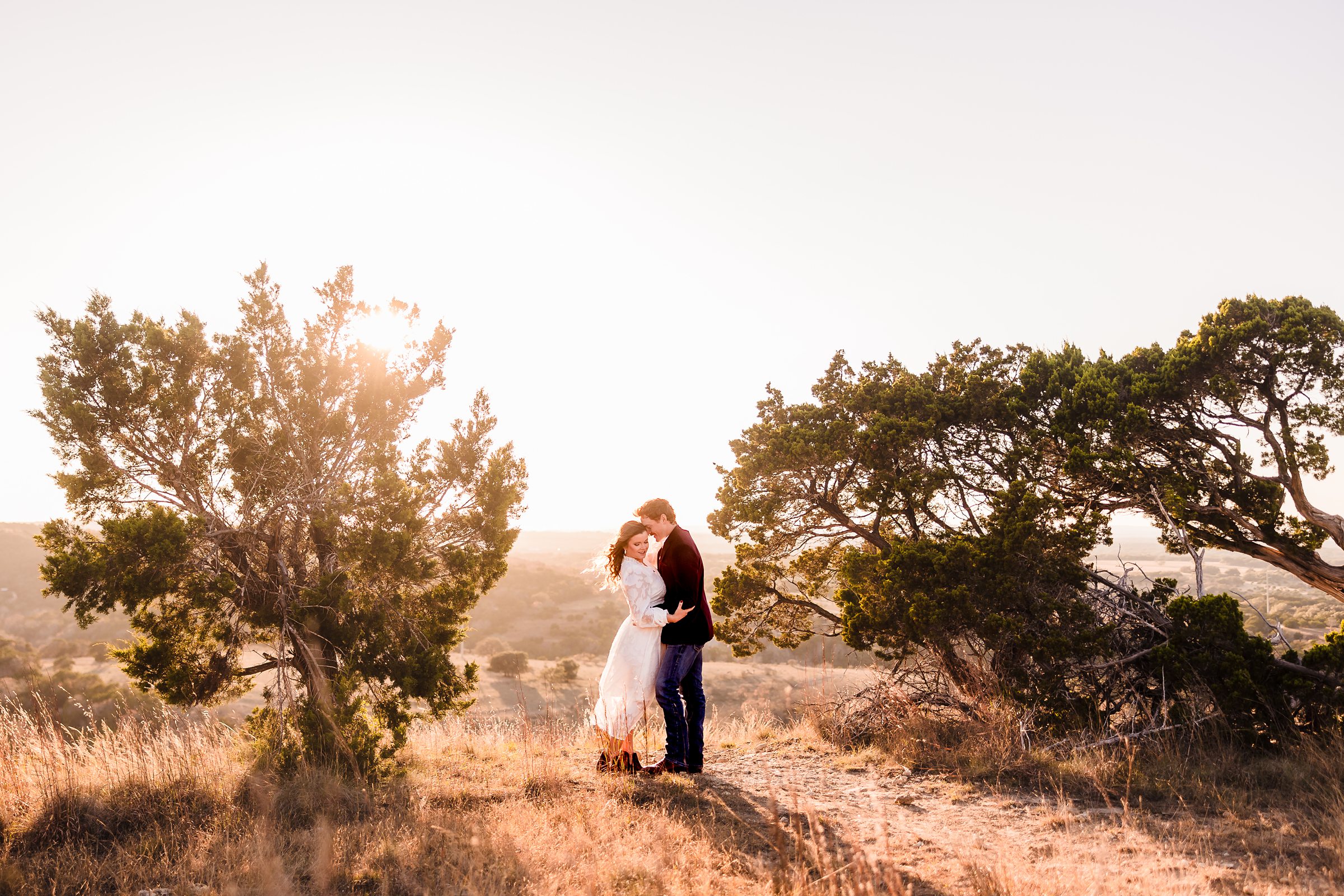 Bride and Groom embrace during their elopement in Dripping Springs, Texas