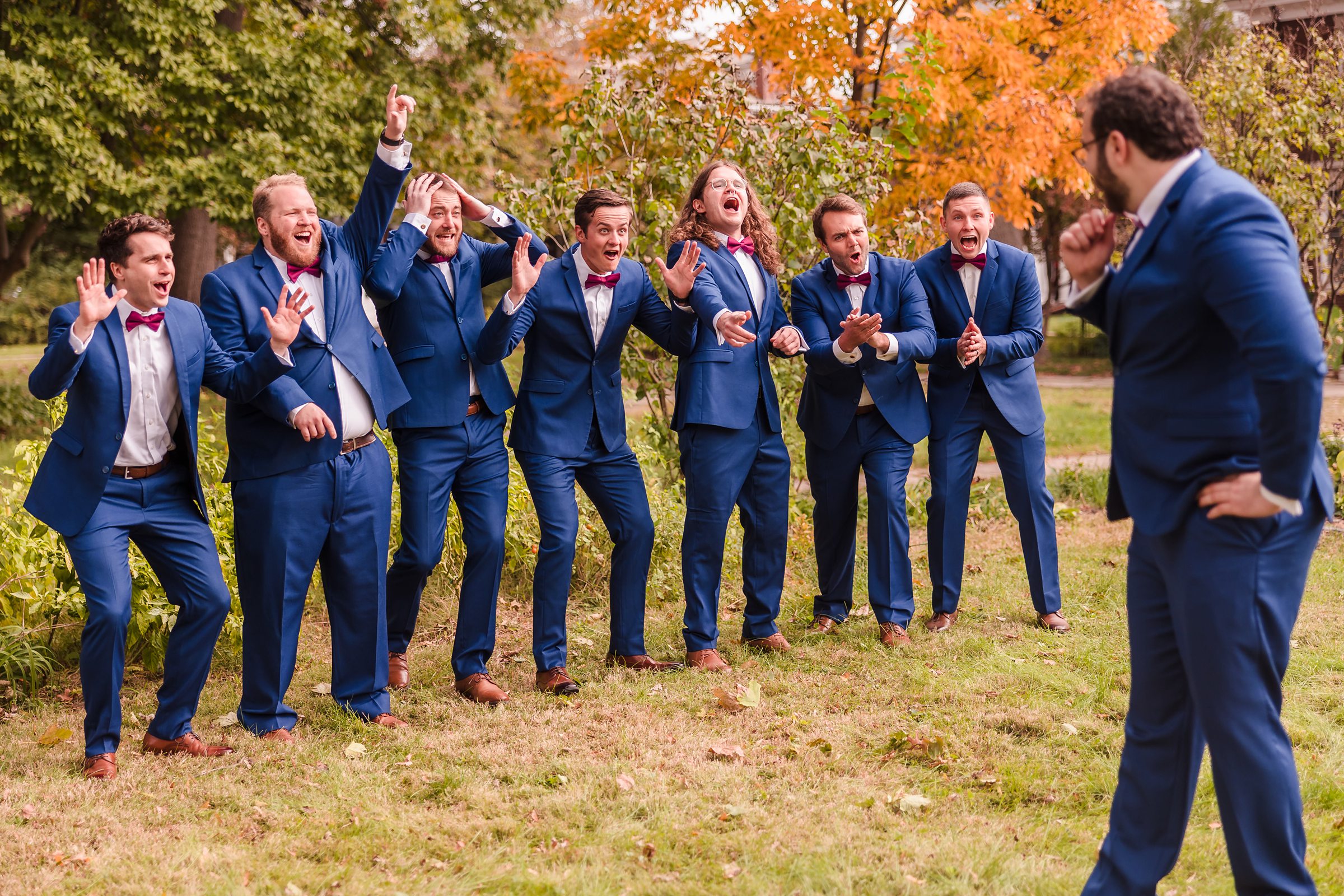 Groomsmen get excited to see the groom during a wedding at the Hotel Pere Marquette in Peoria, Illinois.