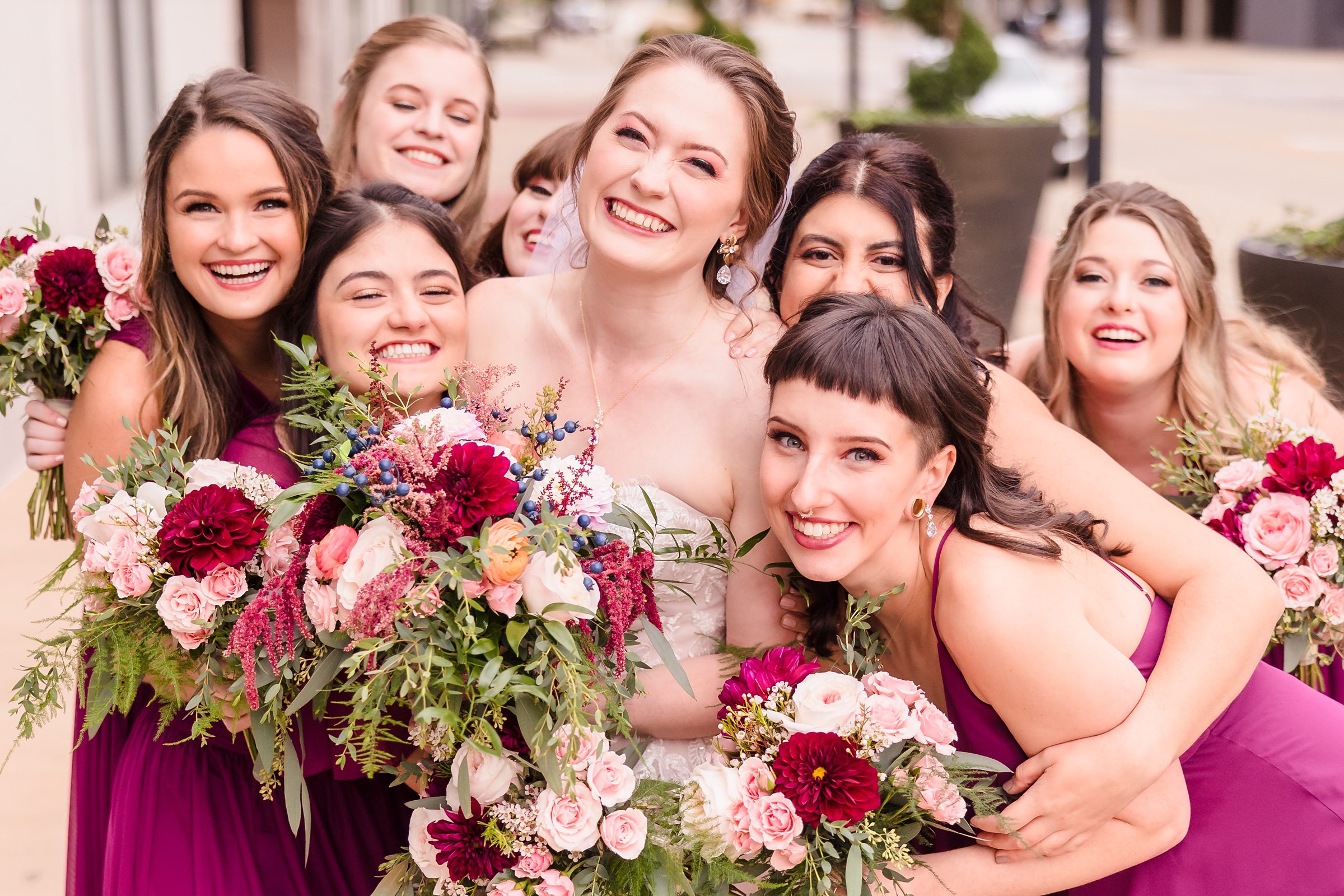 Bride celebrates with her bridesmaids during her wedding at the Hotel Pere Marquette in Peoria, Illinois.