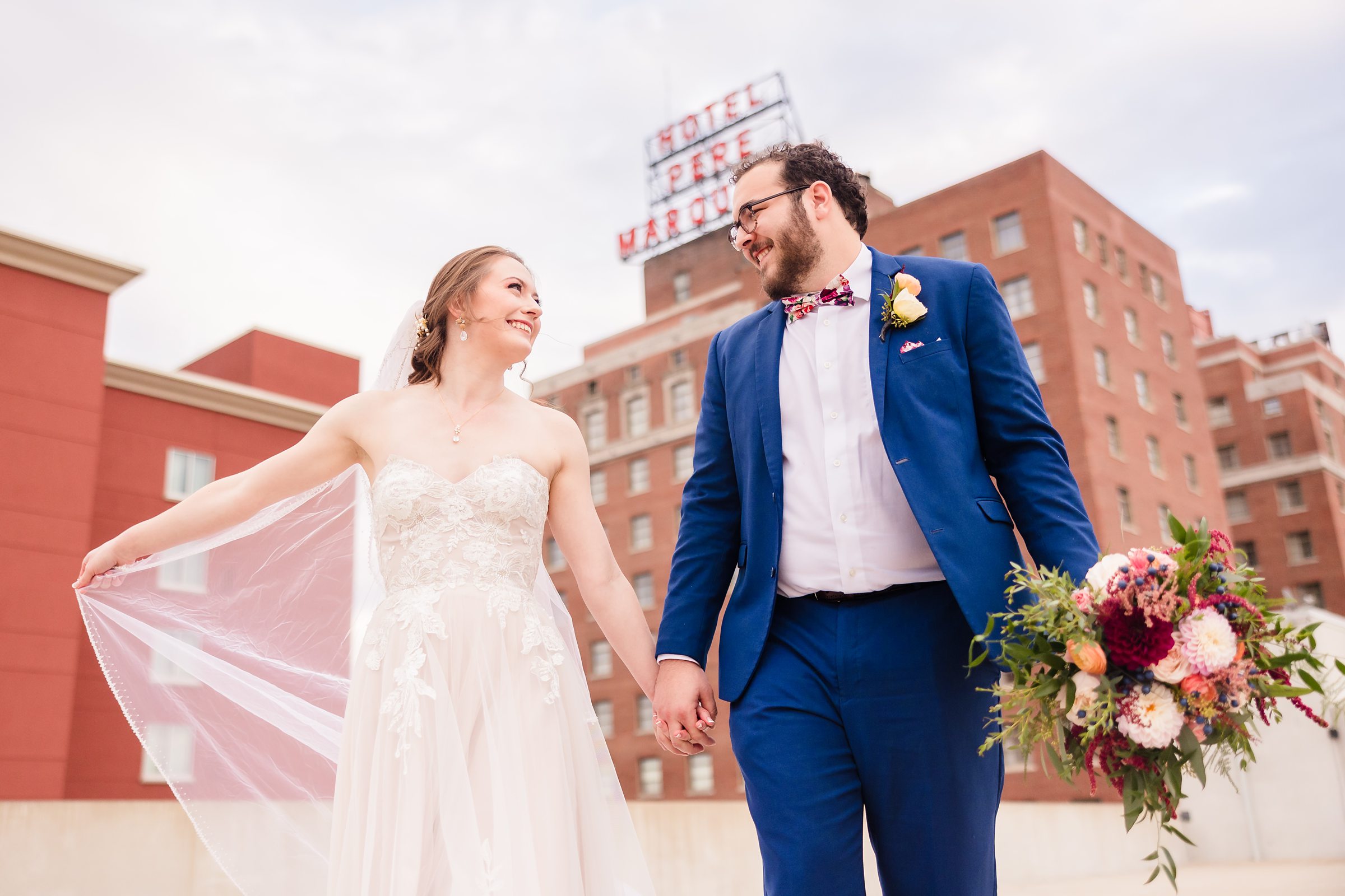 Bride and groom celebrate getting married at the Hotel Pere Marquette in Peoria, Illinois.