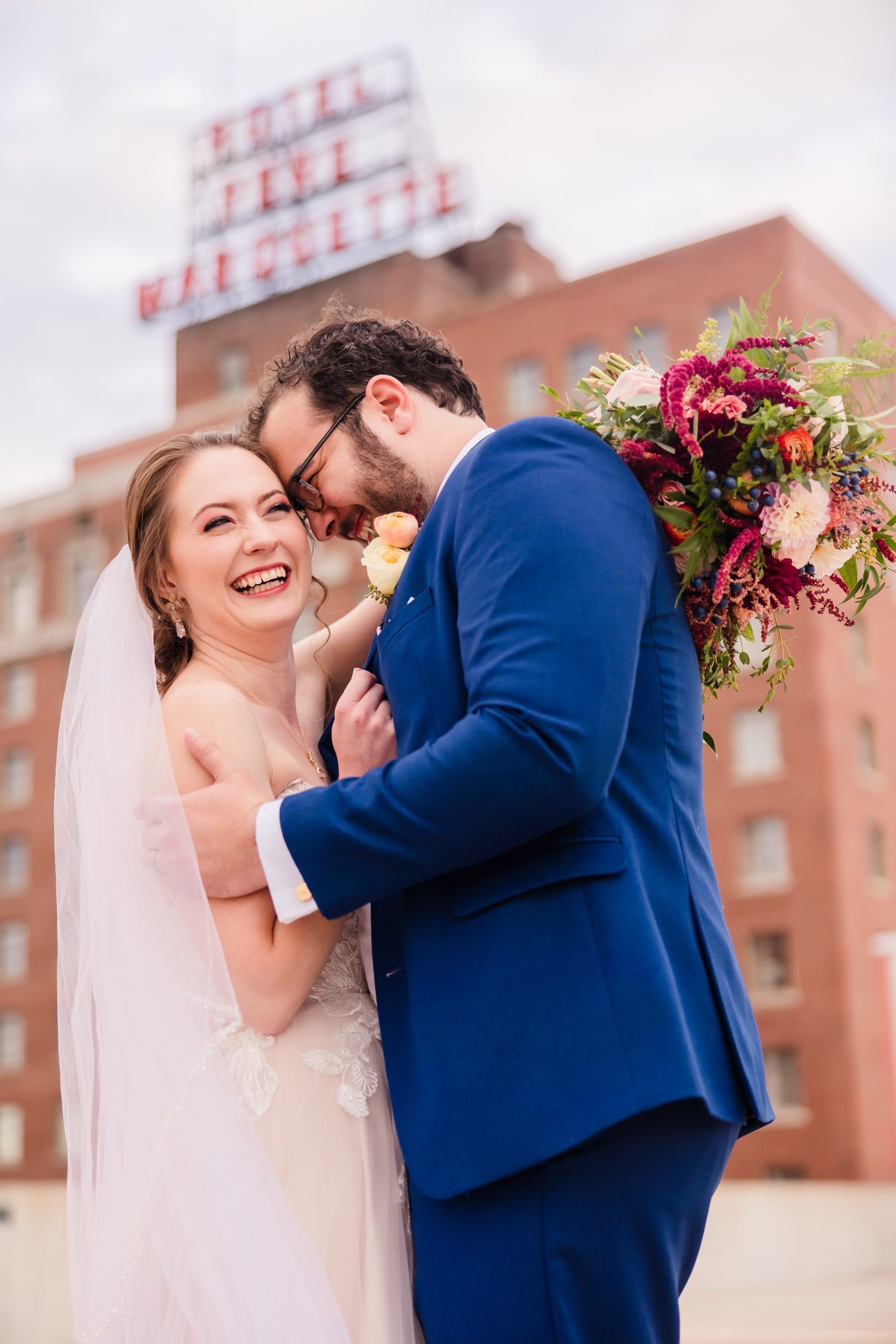 Bride and groom celebrate getting married at the Hotel Pere Marquette in Peoria, Illinois.