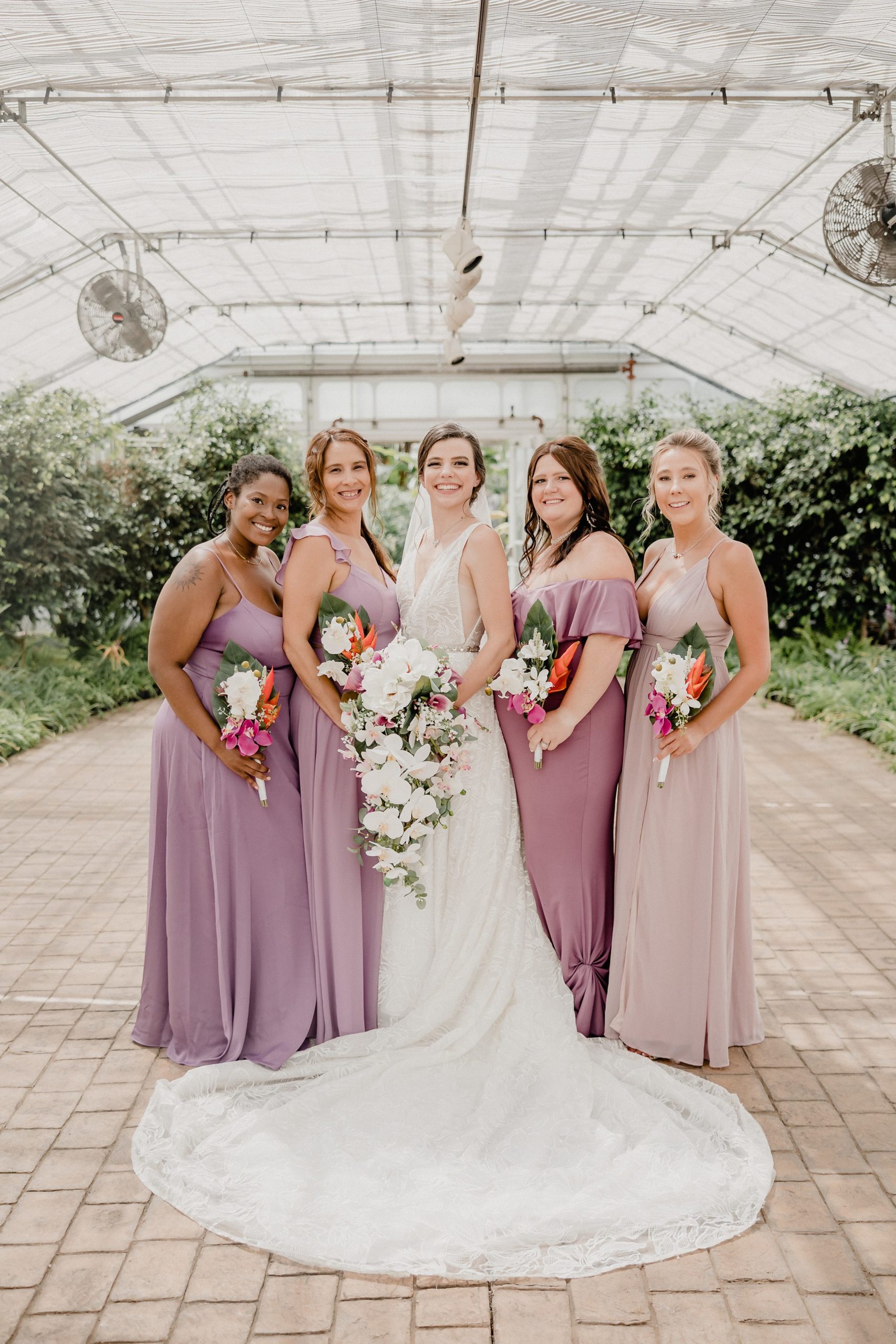 Bride and Bridesmaids during a wedding at the Bird Haven Greenhouse & Conservatory in Joliet, Illinois.