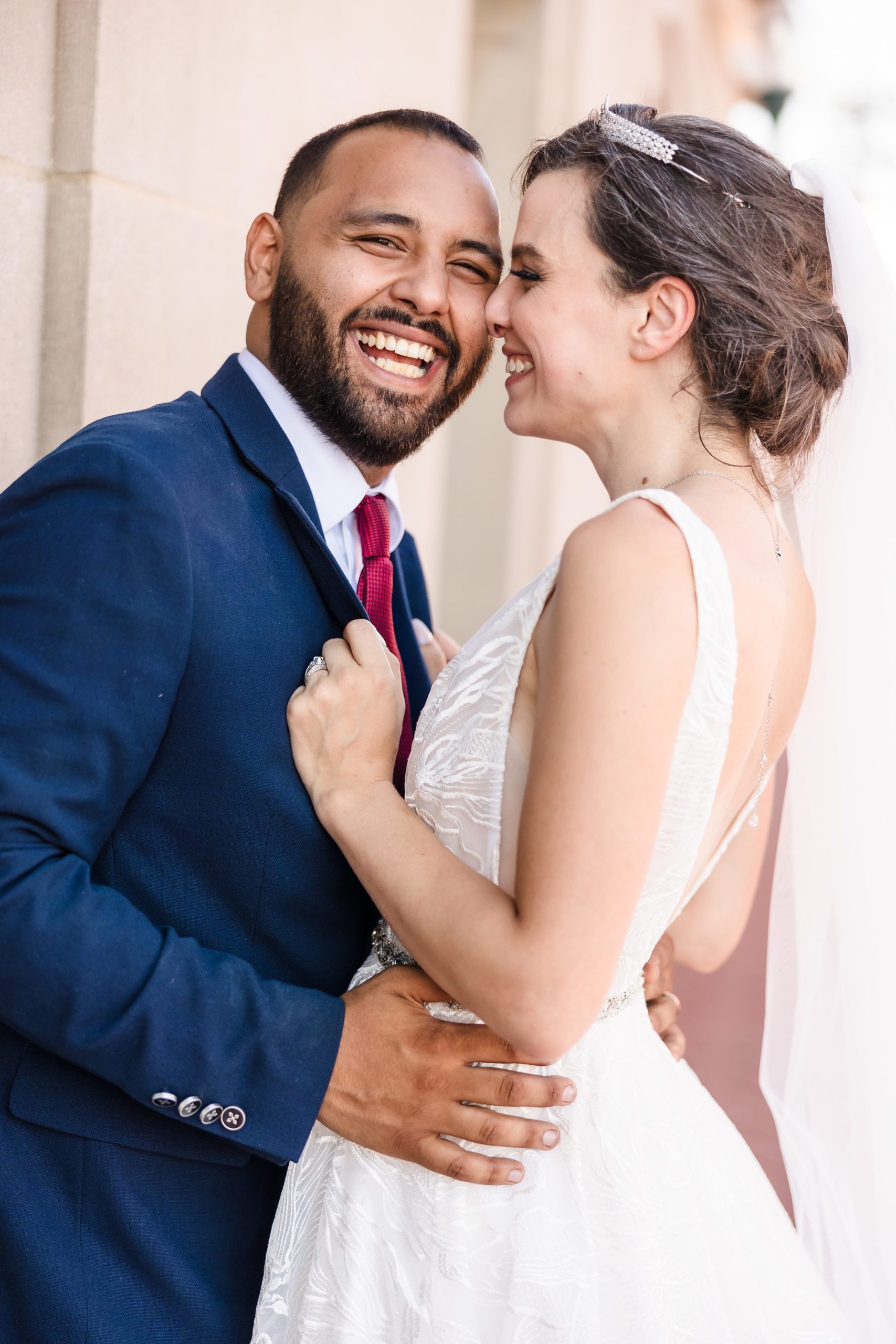 Couple embrace during their wedding at the Union Station in Joliet, Illinois.