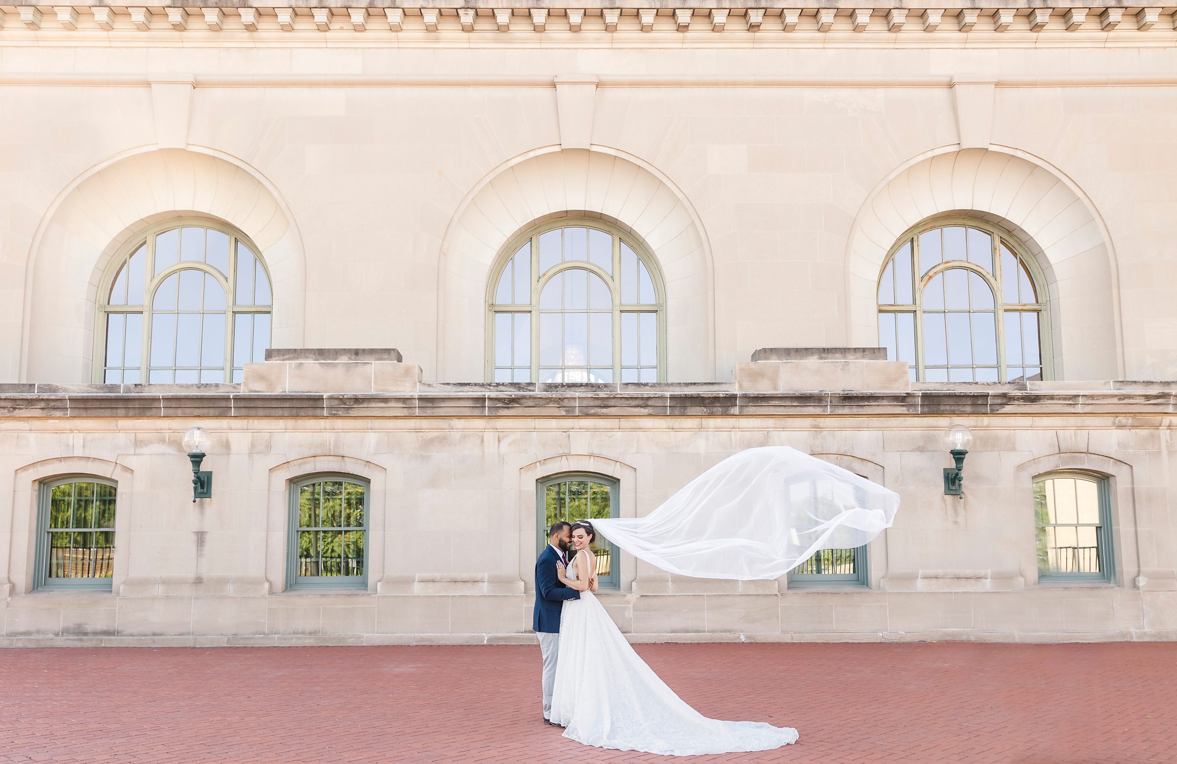 Couple embrace during their wedding at the Union Station in Joliet, Illinois.
