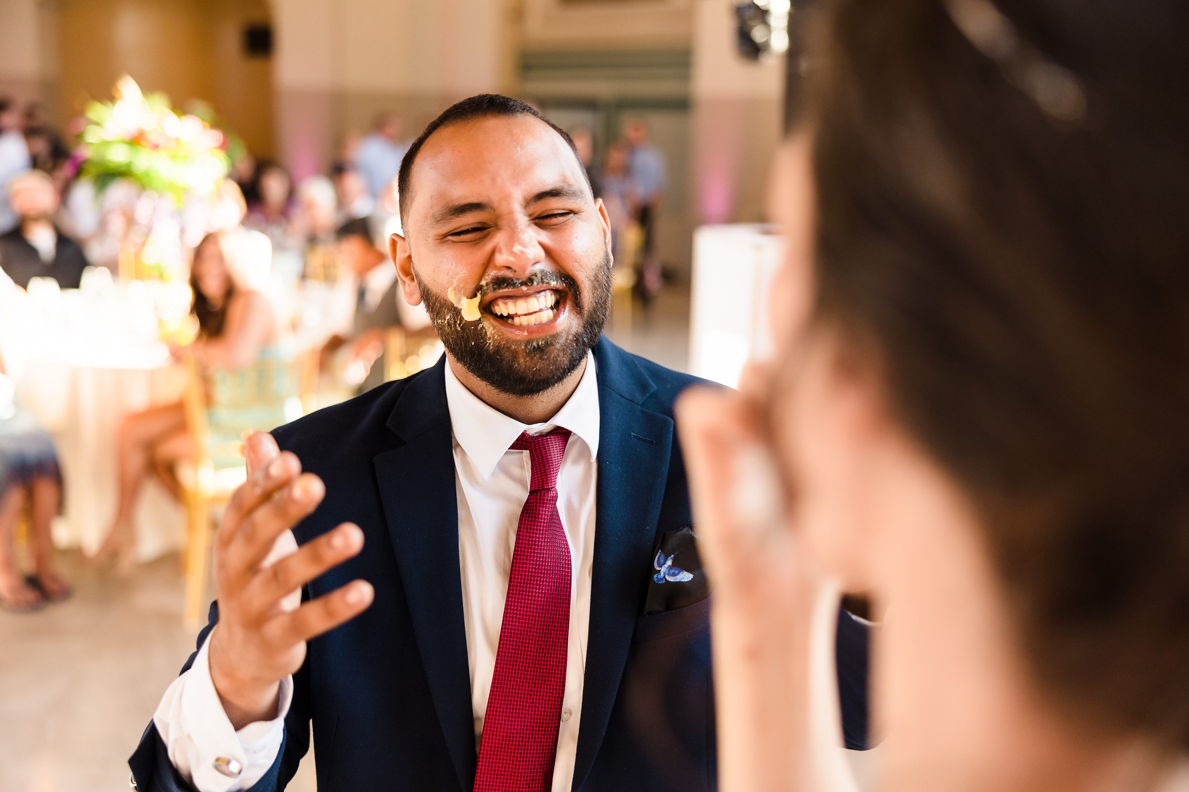 Groom laughs during his wedding at the Union Station in Joliet, Illinois.