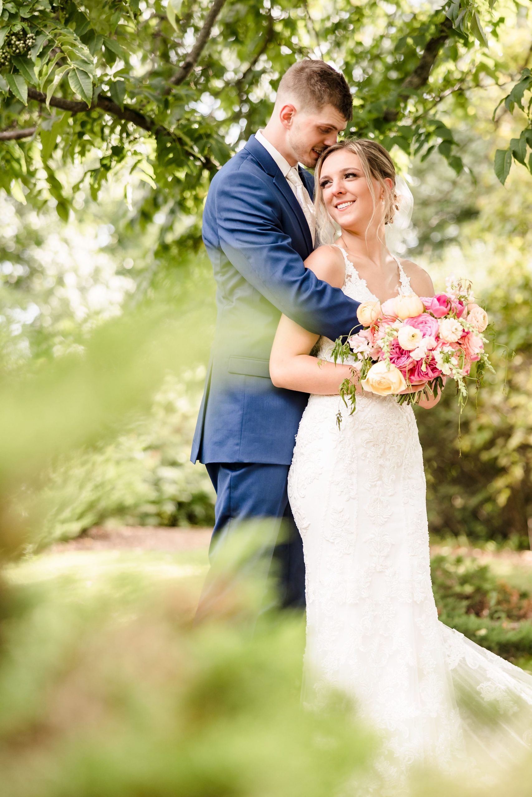 Bride and Groom embrace during their wedding at Luthy Botanical Garden in Peoria, Illinois.