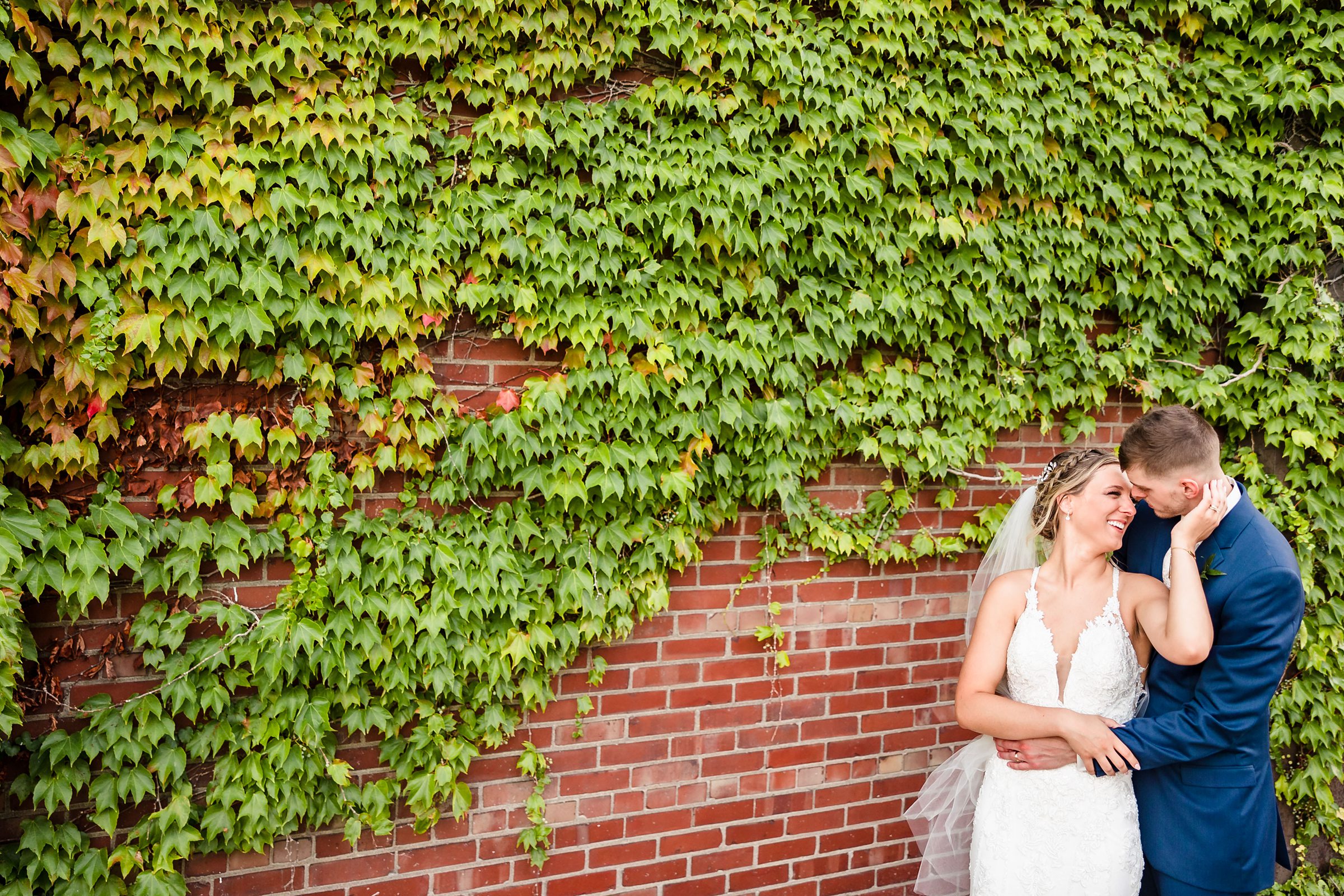 Bride and Groom embrace during their wedding at the Warehouse on State Street in Peoria, Illinois