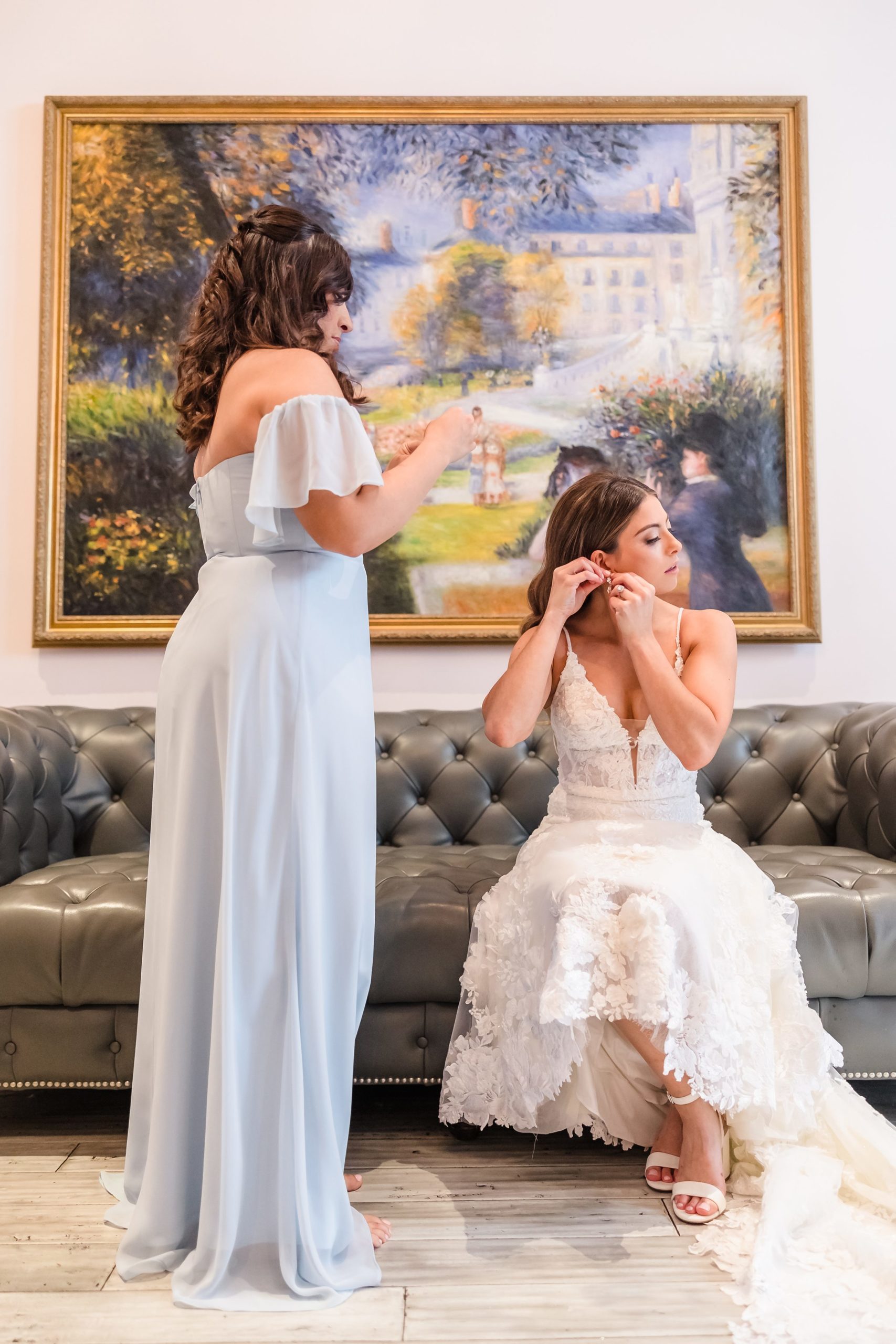 Bride gets dressed before her wedding at the Monte Bello Estate in Lemont, Illinois.