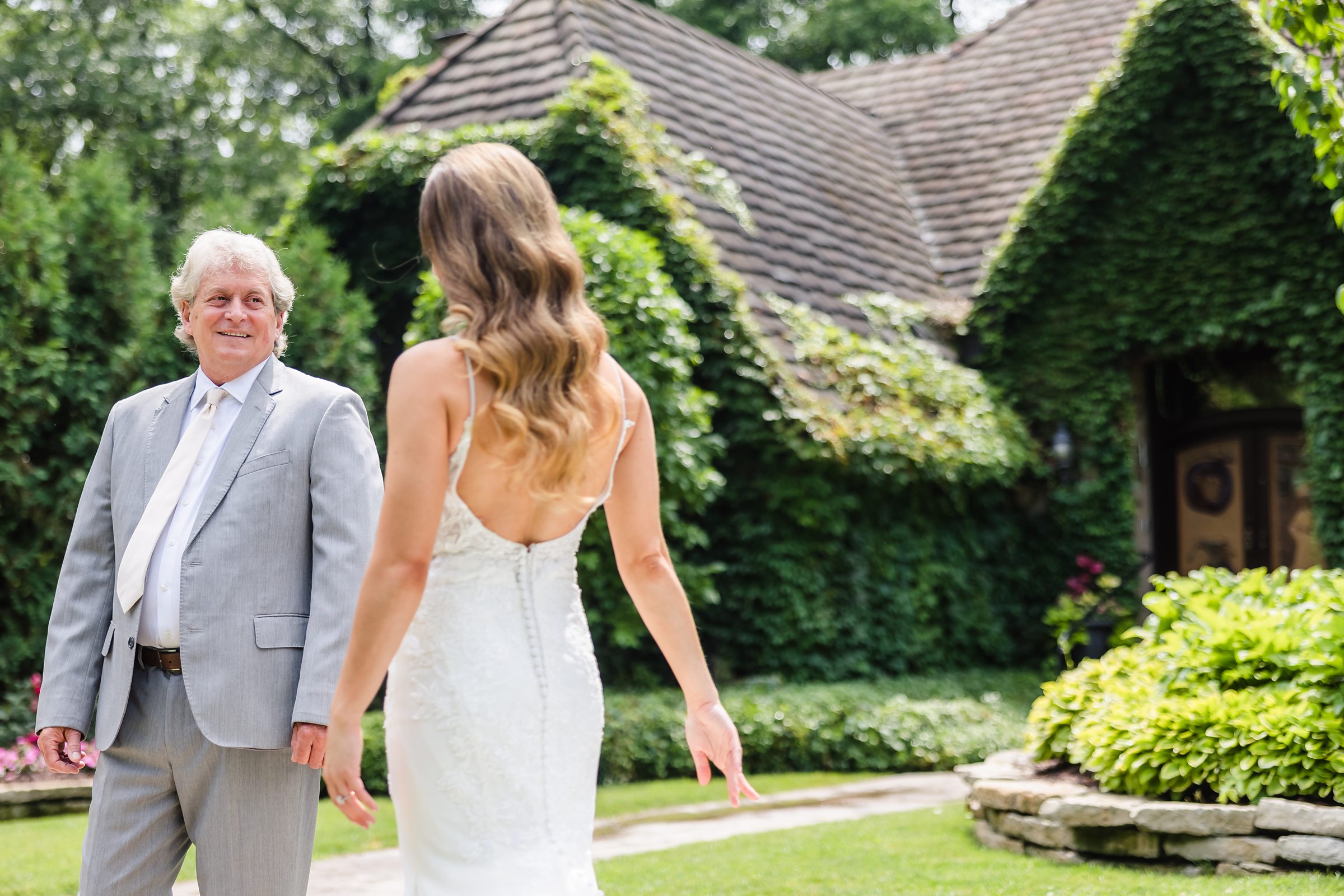 Dad sees the bride for the first time before a wedding at the Monte Bello Estate in Lemont, Illinois.
