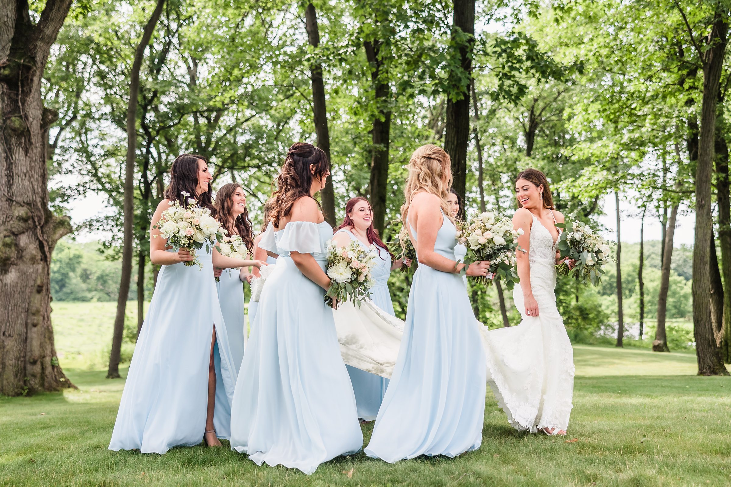 Bride with her bridesmaids during her wedding at the Monte Bello Estate in Lemont, Illinois.