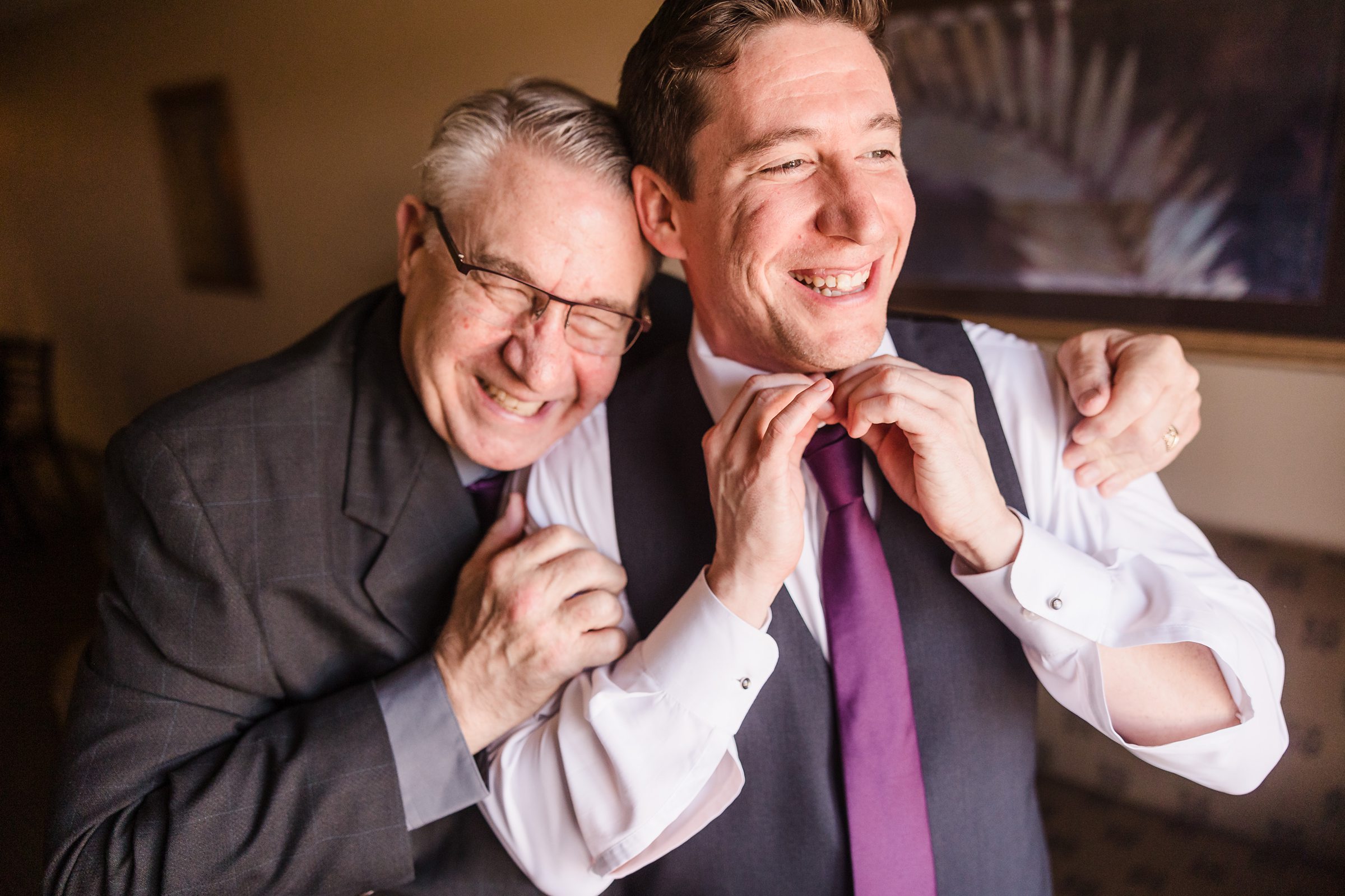 Dad and groom hug before his wedding at the Trailside Event Center in Peoria Heights, Illinois.