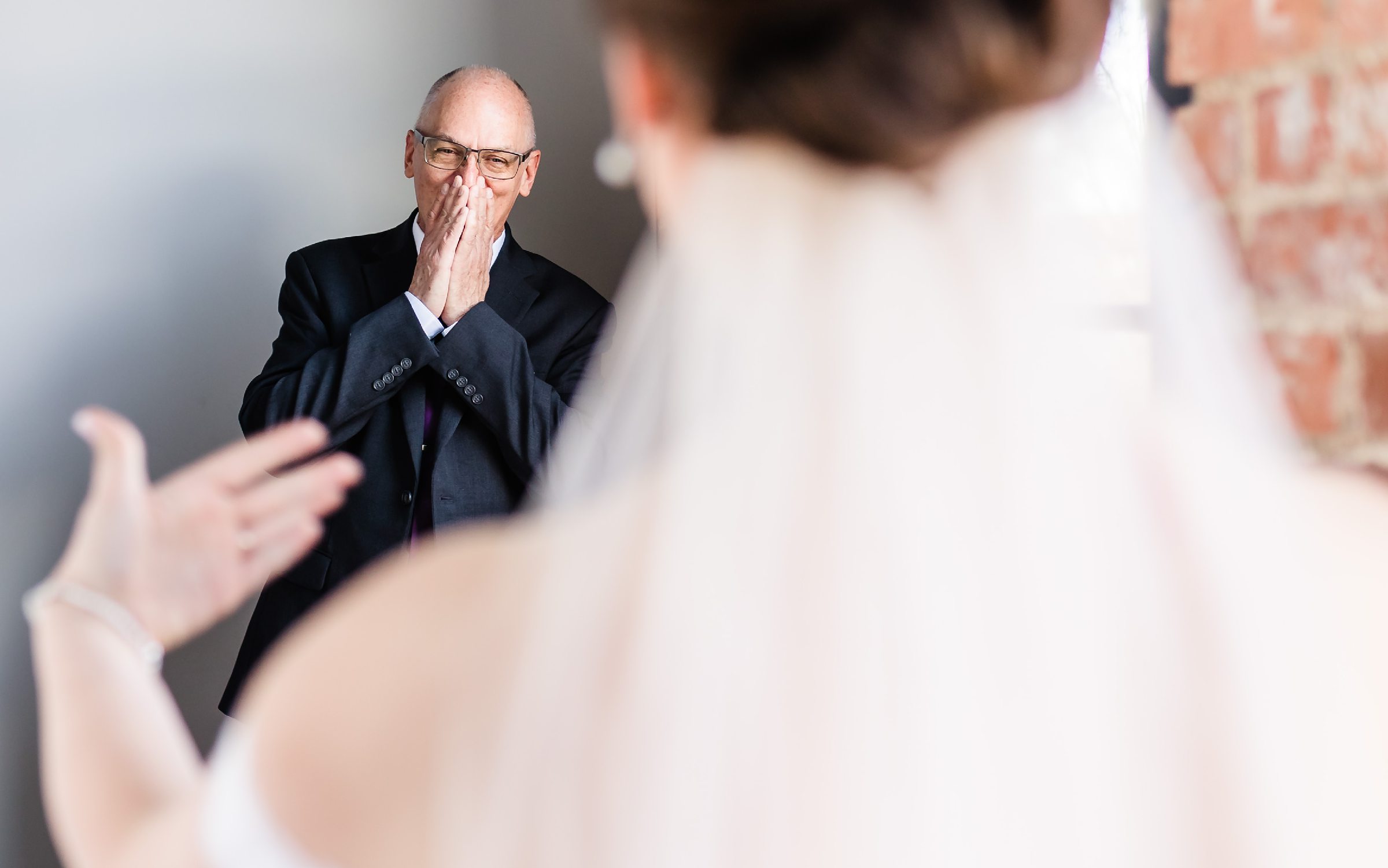 Dad reacts to seeing the bride before her wedding at the Trailside Event Center in Peoria Heights, Illinois.