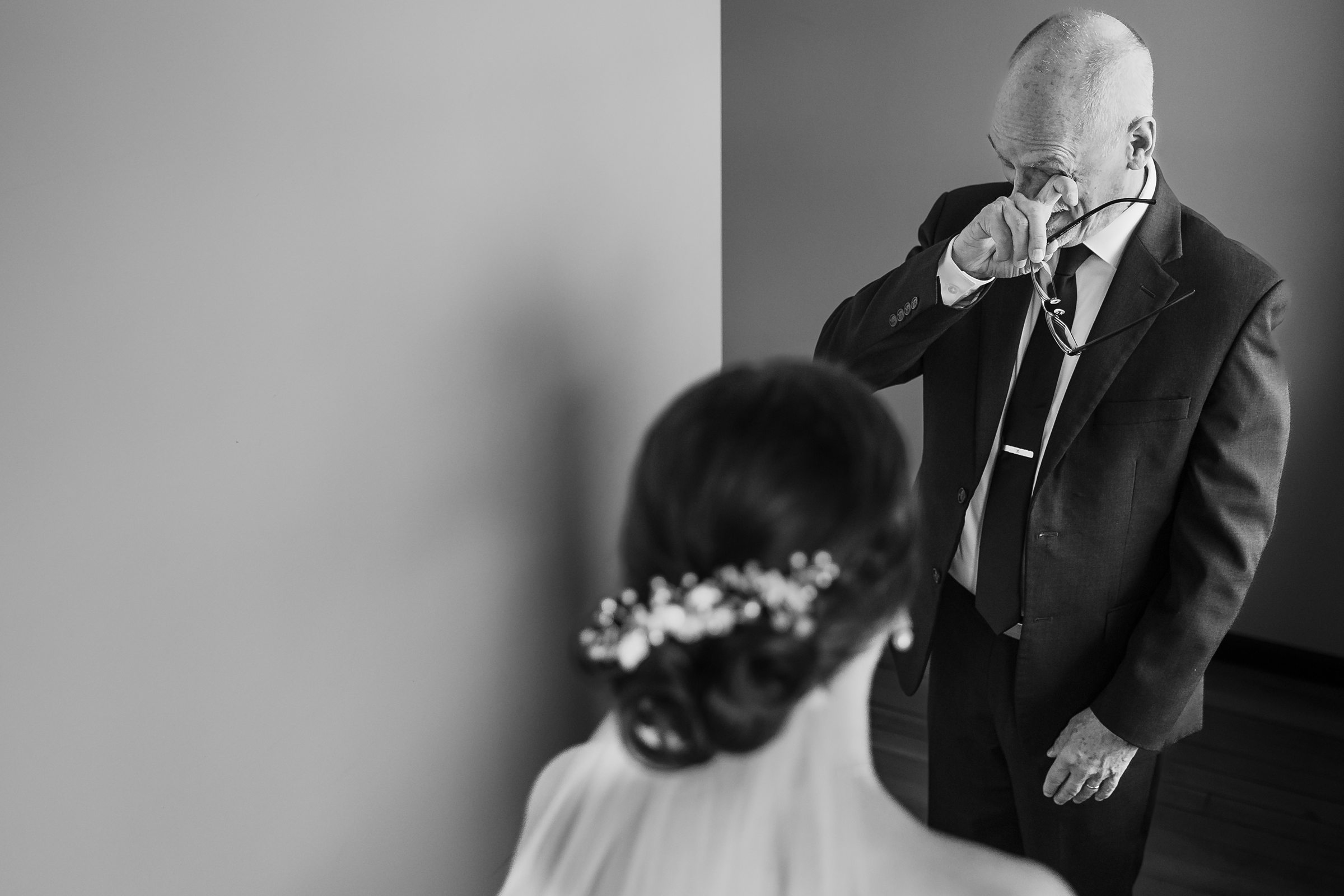 Dad cries before his daughters wedding at the Trailside Event Center in Peoria Heights, Illinois.