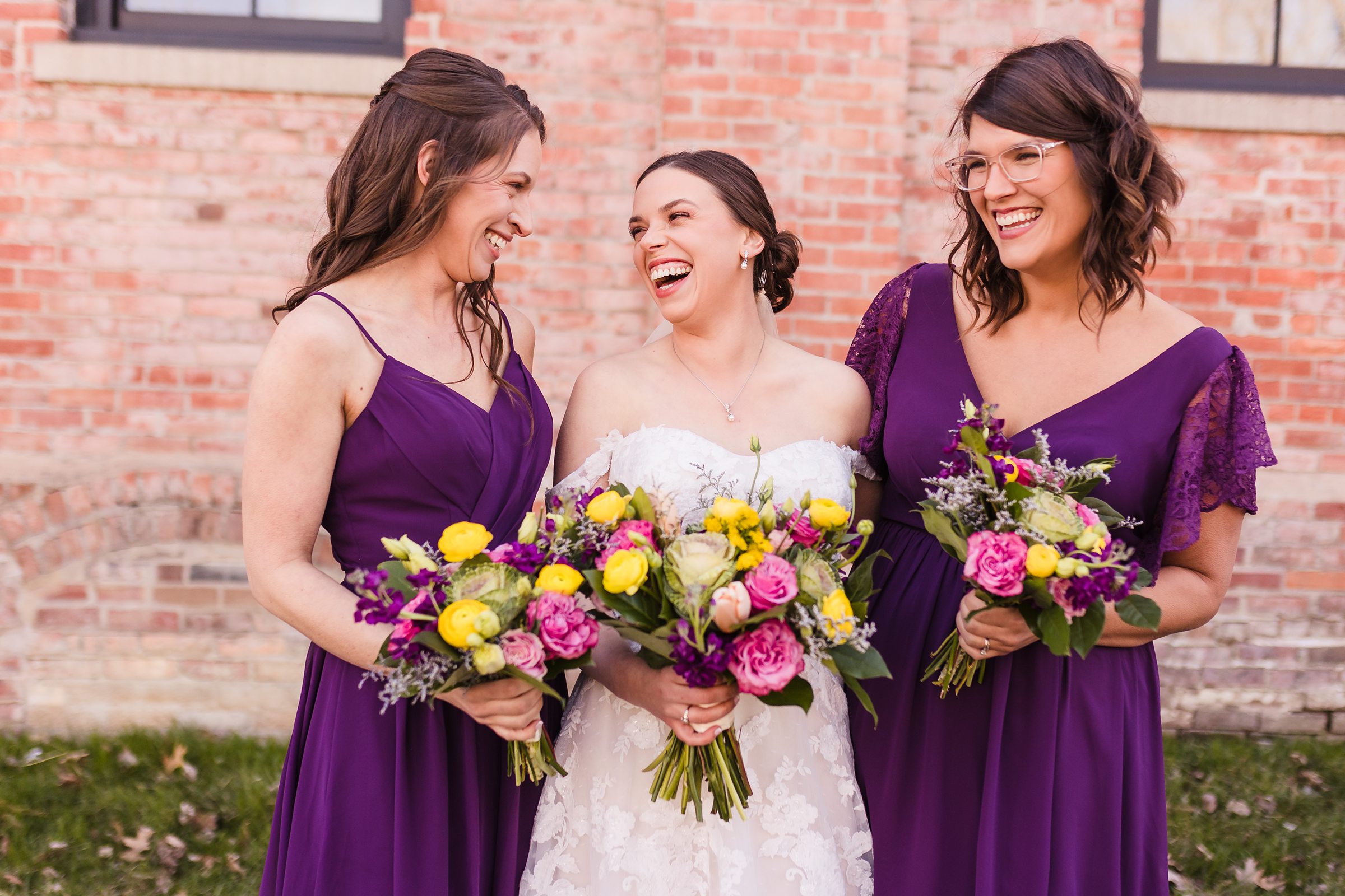 Bride celebrates with her bridesmaids during her wedding at the Trailside Event Center in Peoria Heights, Illinois.