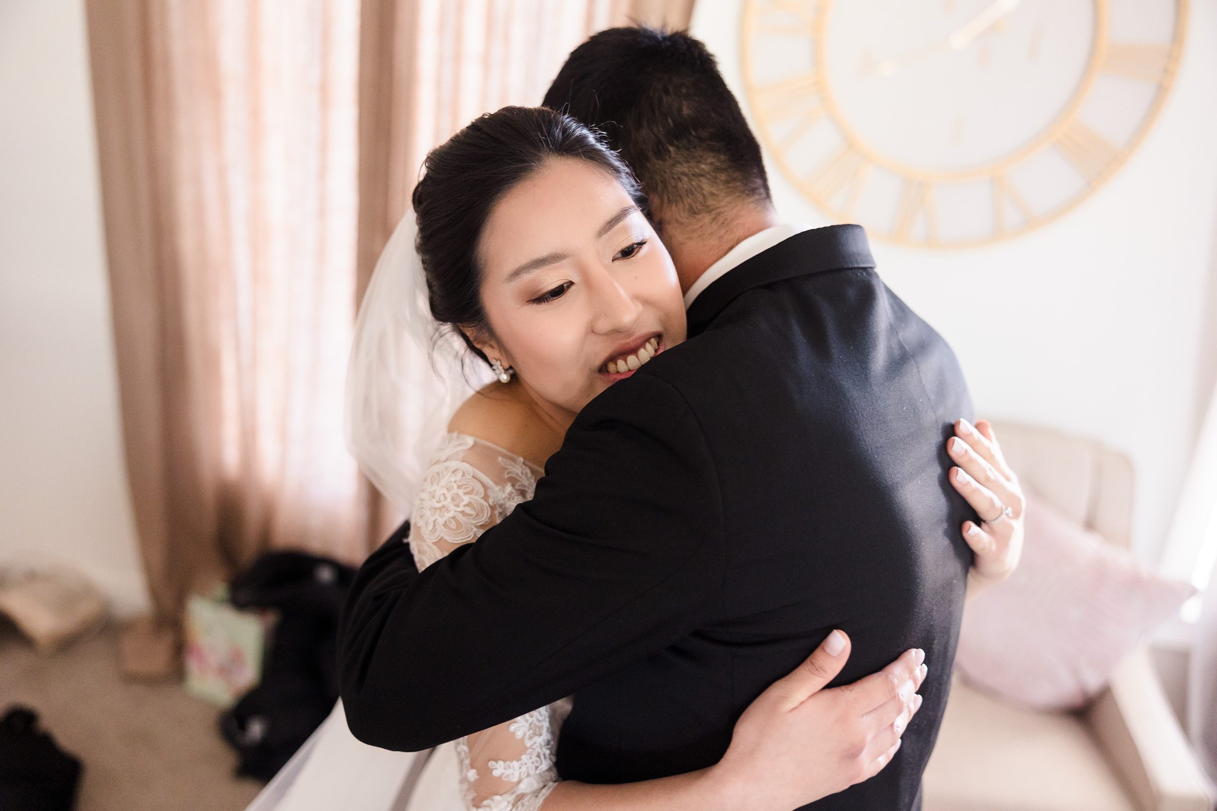 Couple embrace during their wedding at the Ritz Charles in Carmel, Indiana.