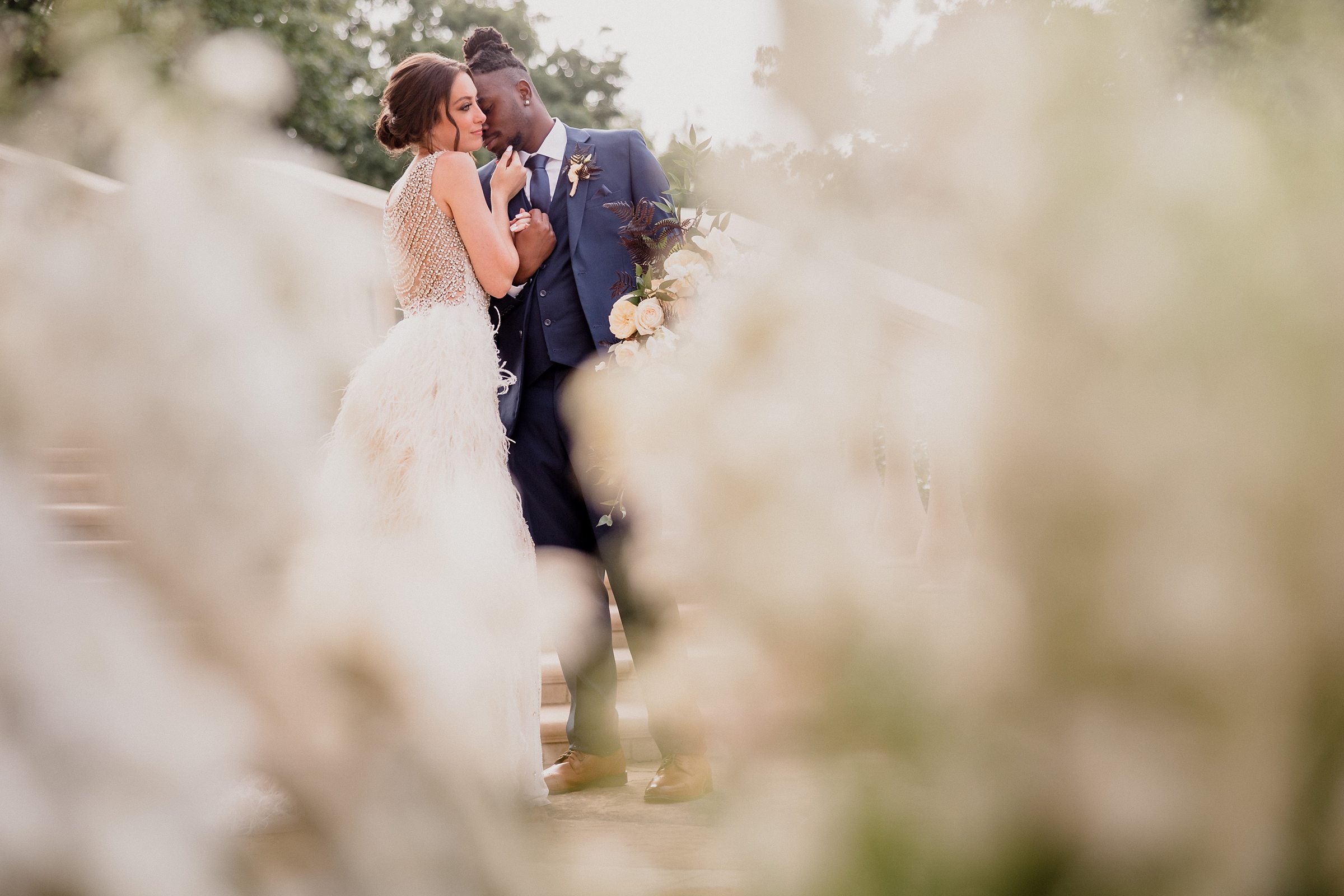 Bride and groom embrace during a wedding at the Olana Wedding Venue in Hickory Creek, Texas.