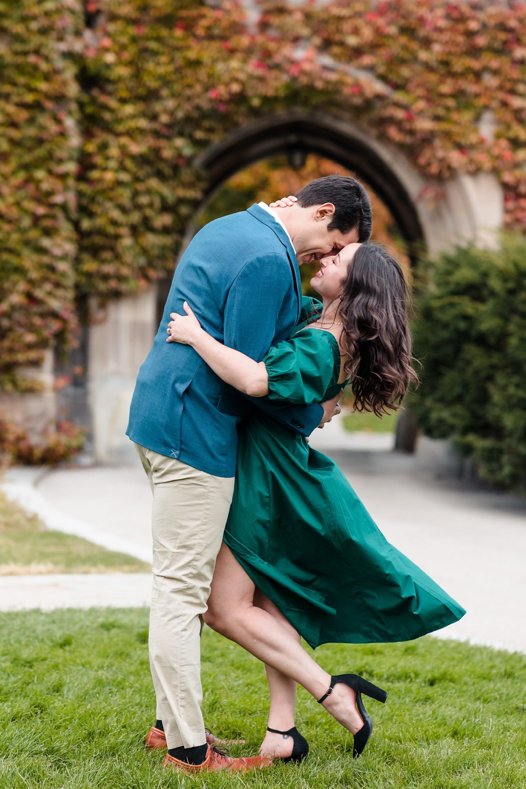 Couple embrace during their engagement session at the University of Chicago in Chicago, Illinois.