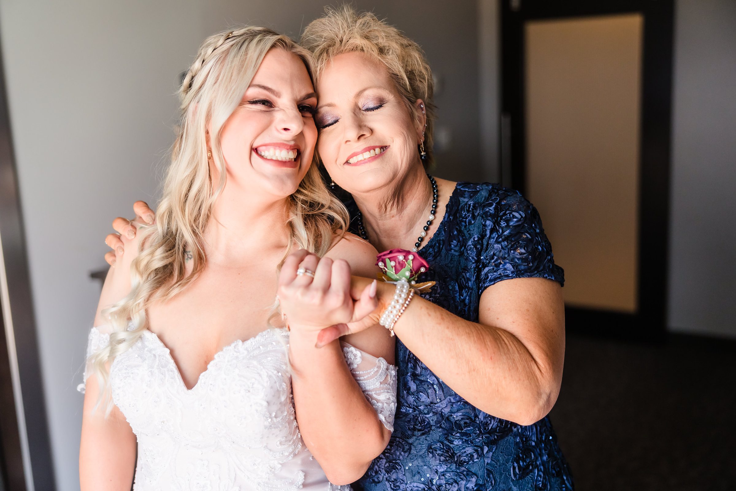 Bride and her mom embrace before the wedding at the Warehouse on State in Peoria, Illinois