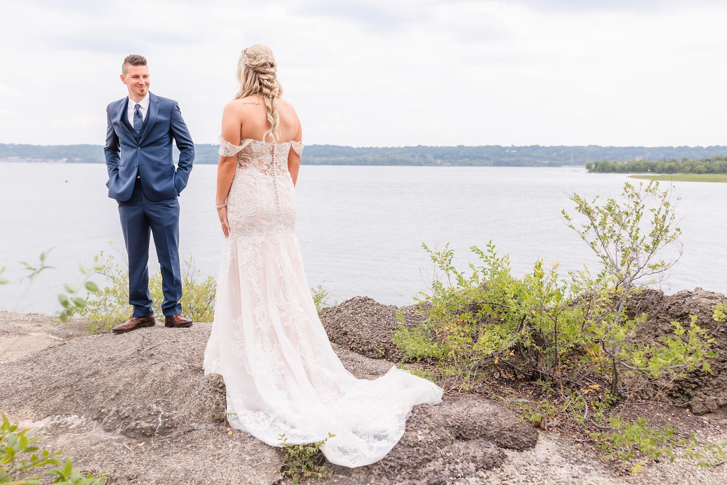 The groom sees his bride for the first time on the Peoria Riverfront in Illinois