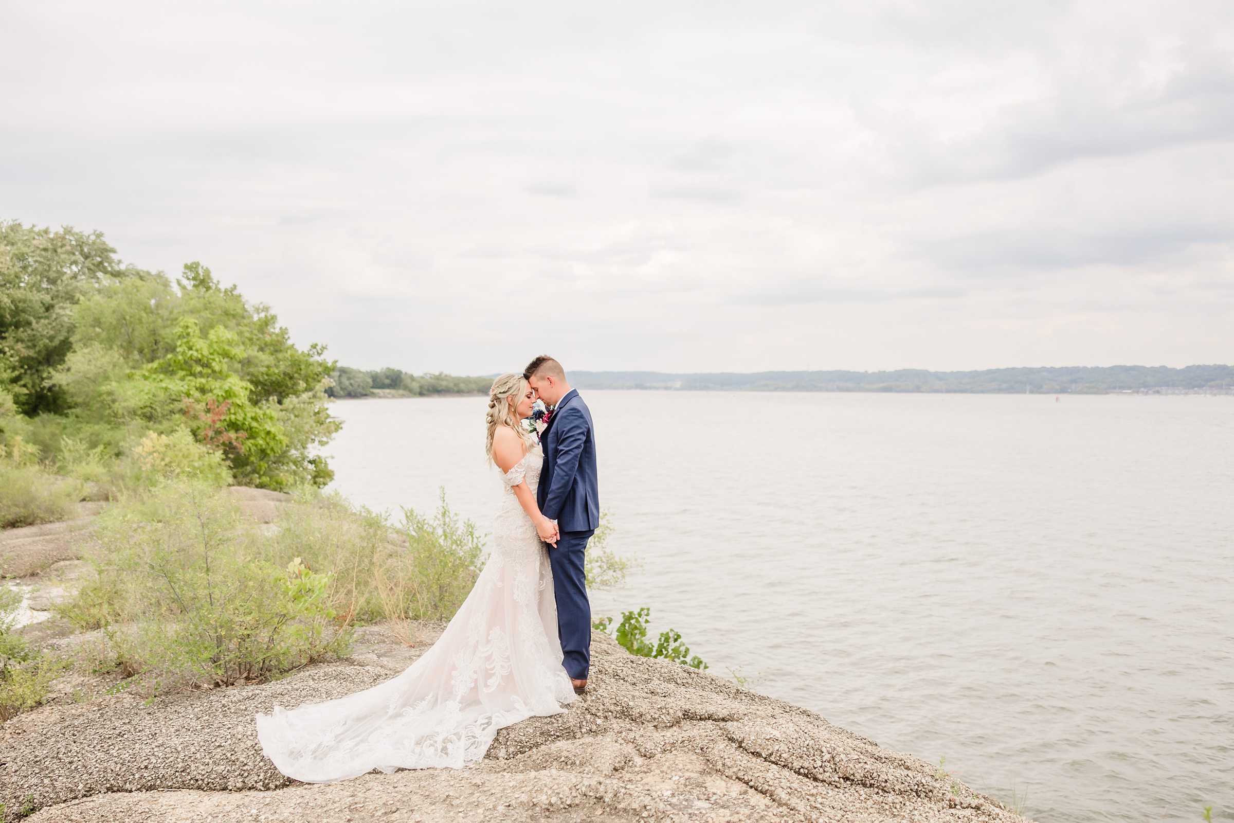 Bride embrace on the Peoria riverfront in Peoria, Illinois