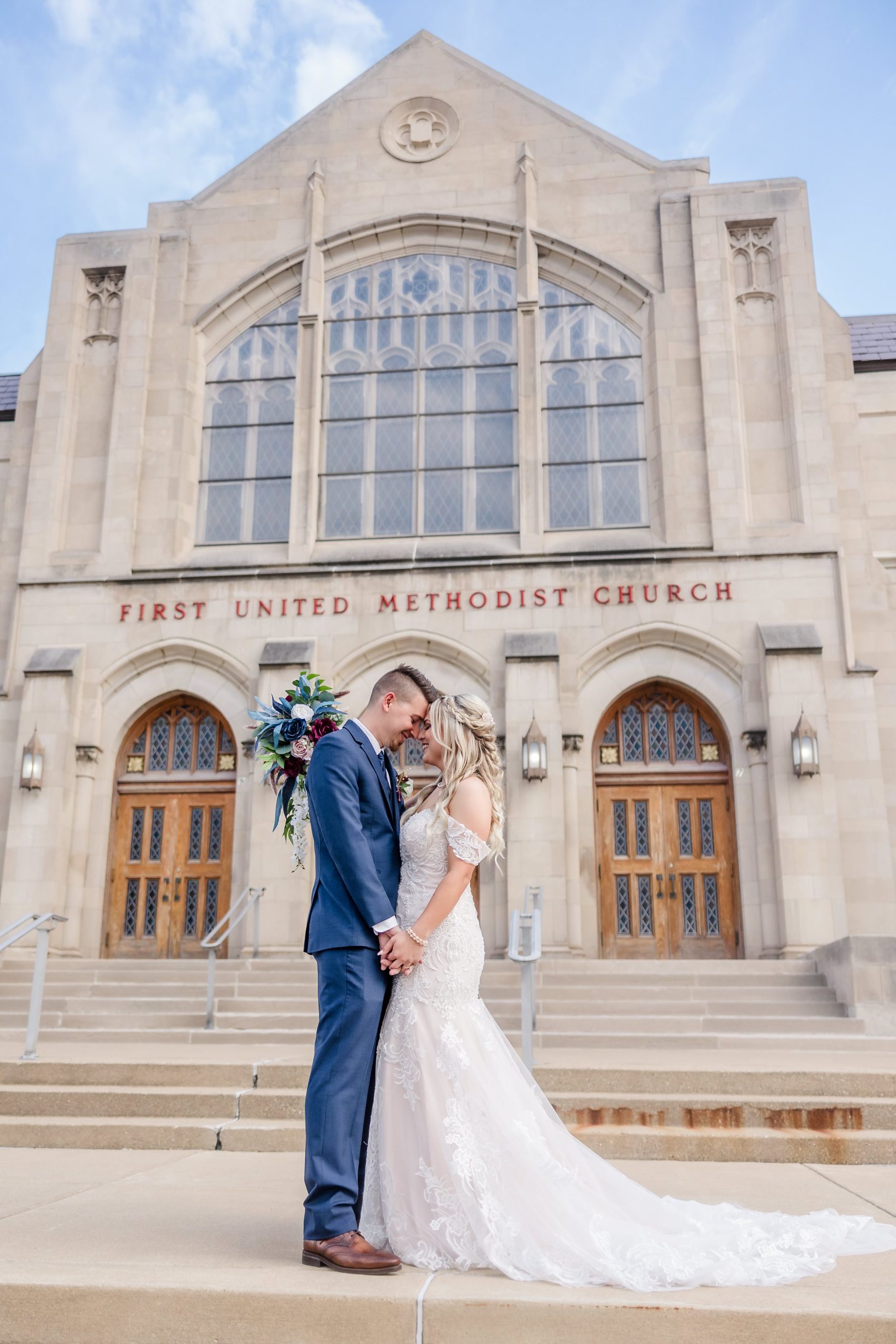 Bride and Groom embrace after their wedding ceremony at the First United Methodist Church in Peoria, Illinois