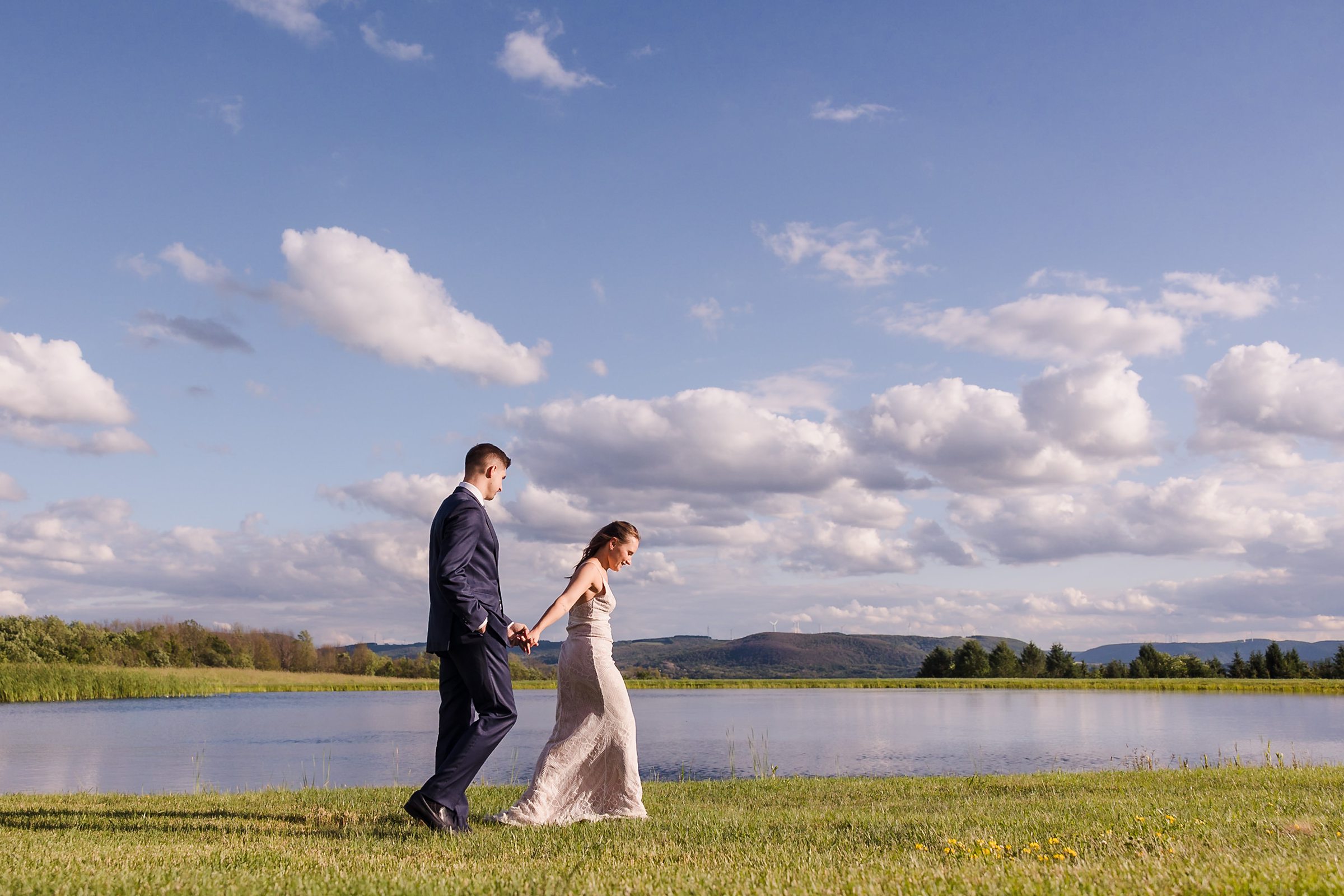 Bride and Groom go for a walk at the Wren's Roost Barn Venue in Naples, New York.