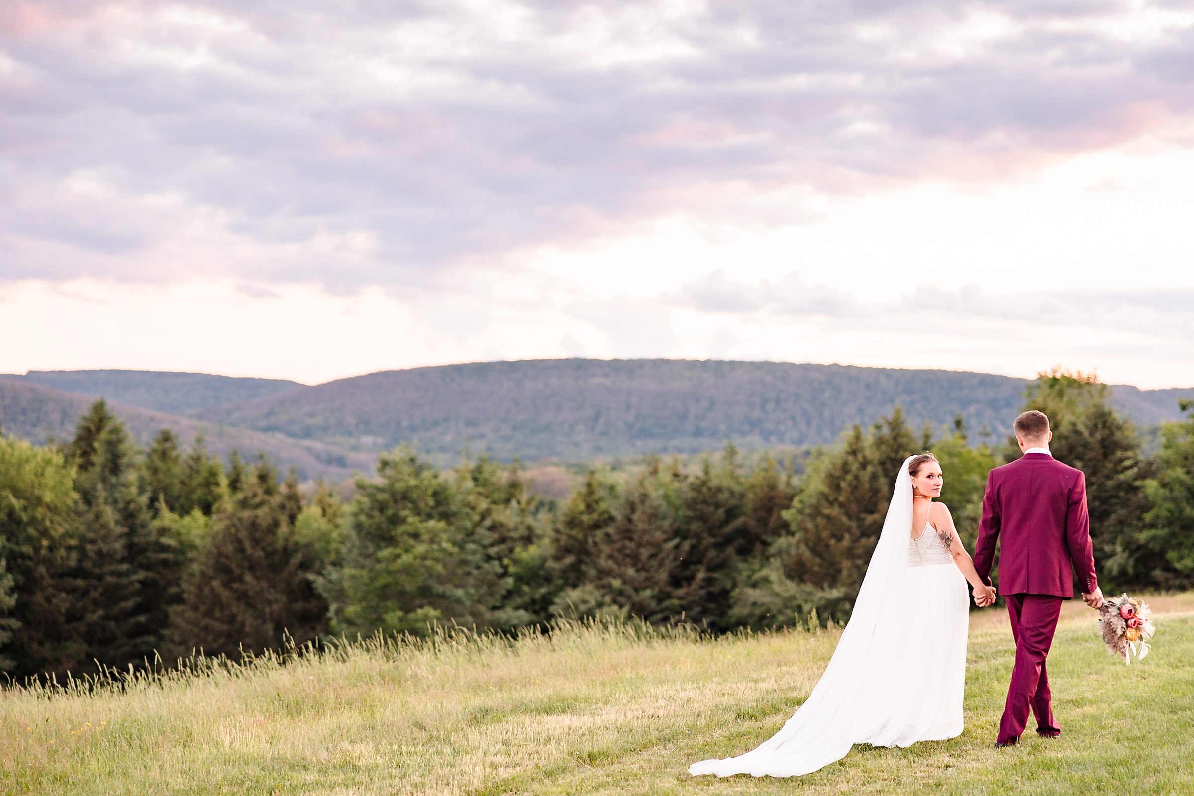 Bride and Groom celebrate getting married at the Wren's Roost Barn Venue in Naples, New York.