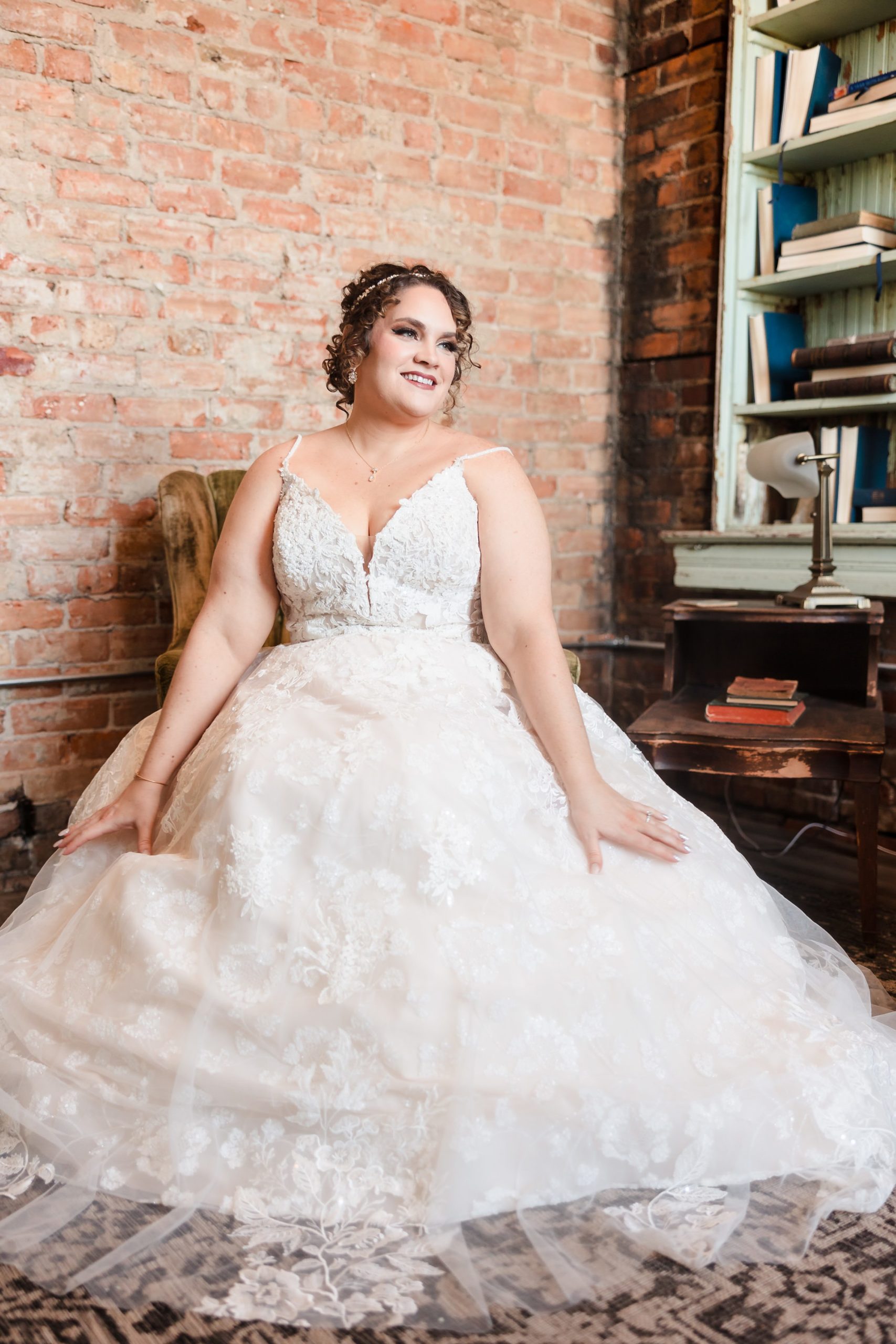 Bride sits down before her wedding at the Legacy Building in El Paso, Illinois.