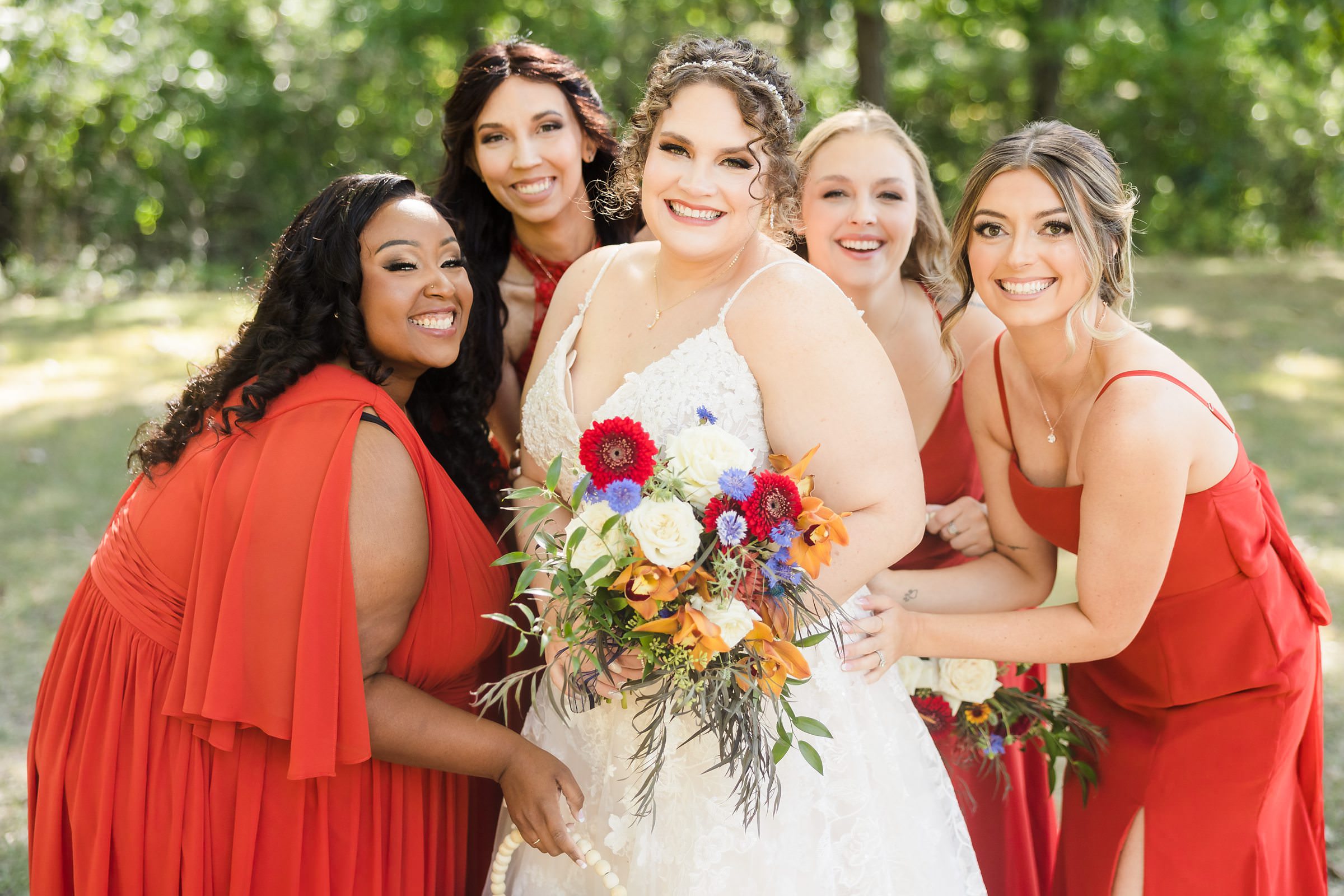 Bride celebrates with her bridesmaids during her wedding at the Legacy Building in El Paso, Illinois.